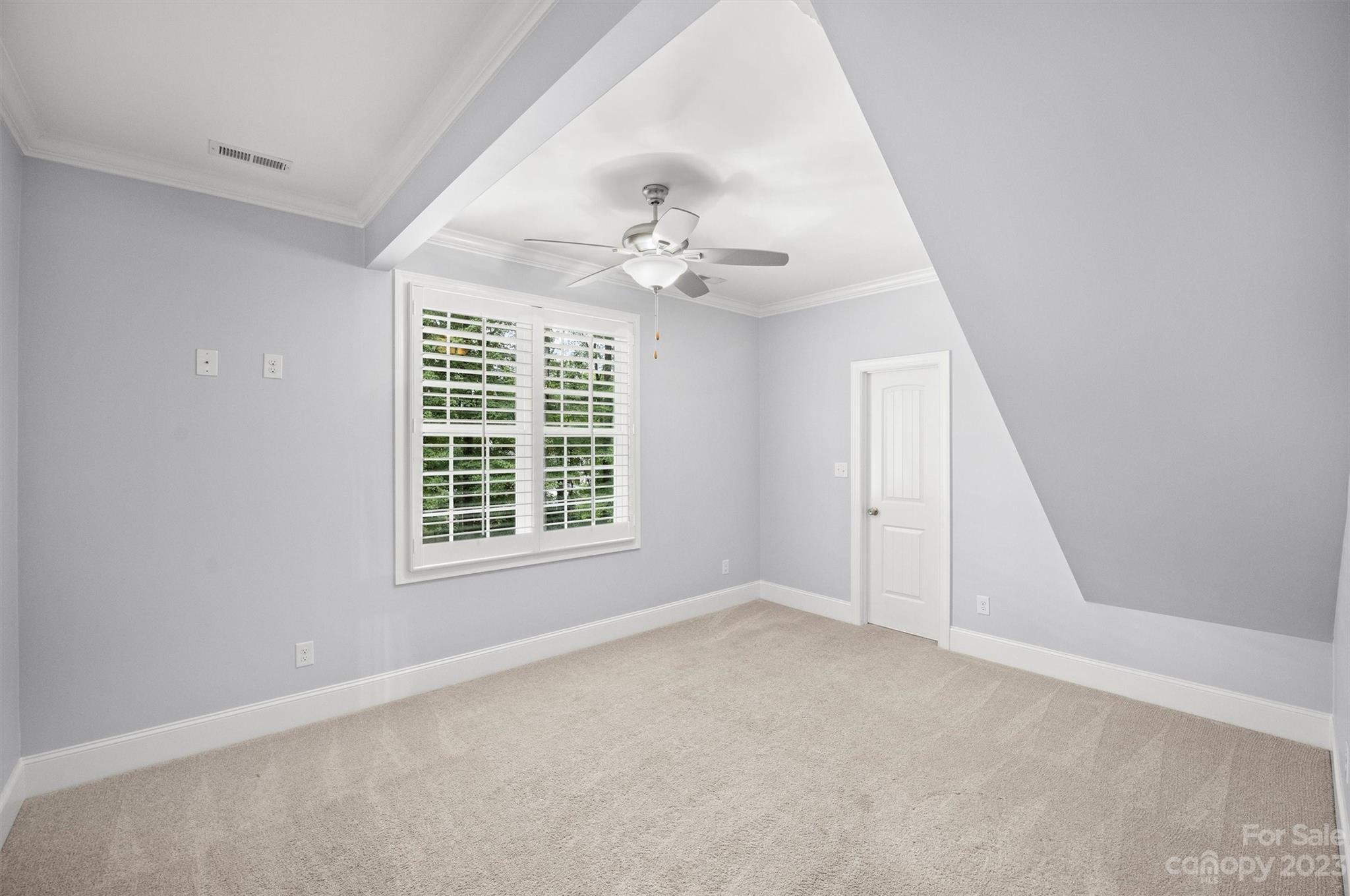 3118 Sharon View Road Charlotte, NC 28210 - Photo 17 of 48 an empty room with windows and fan