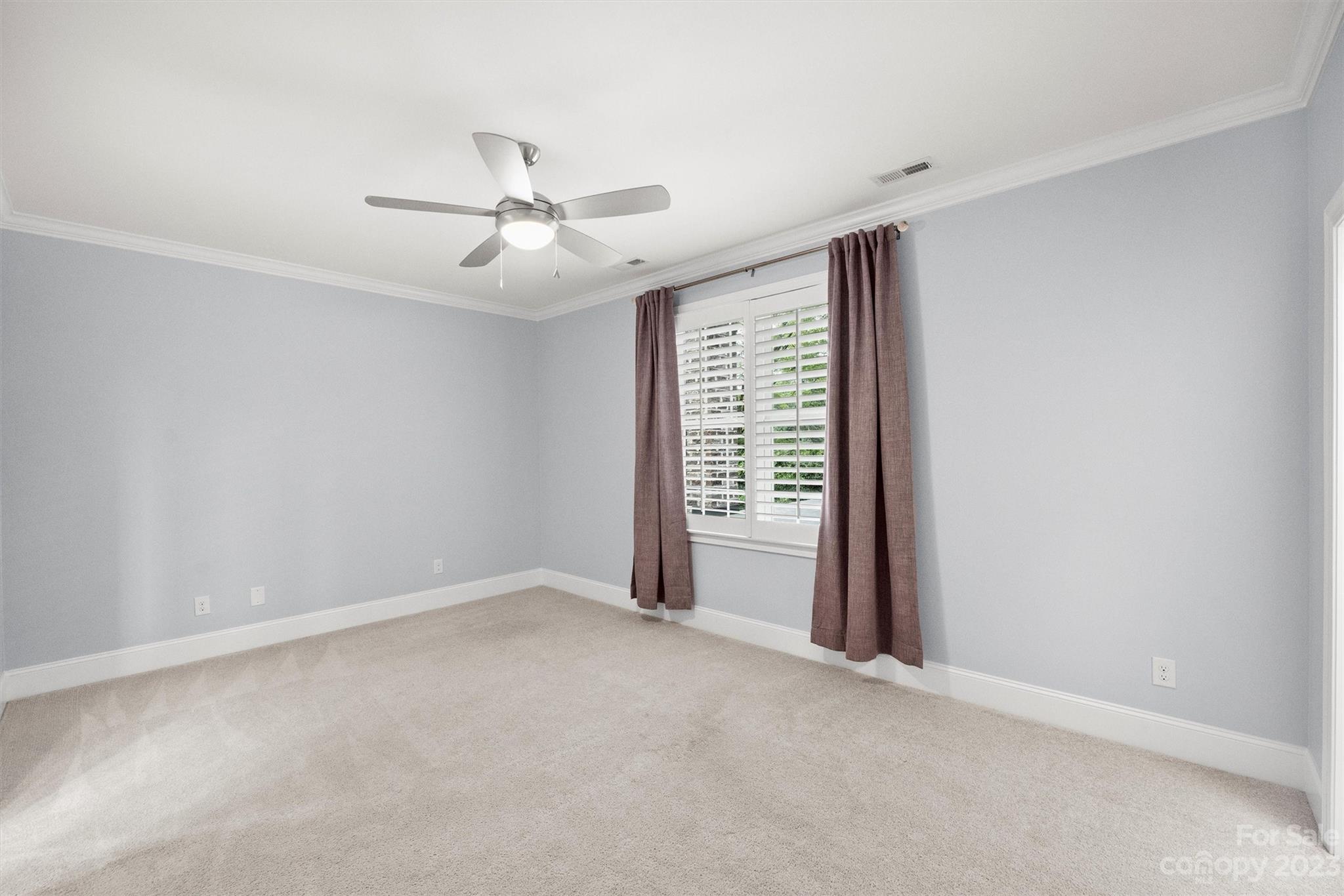 3118 Sharon View Road Charlotte, NC 28210 - Photo 18 of 48 an empty room with windows and fan