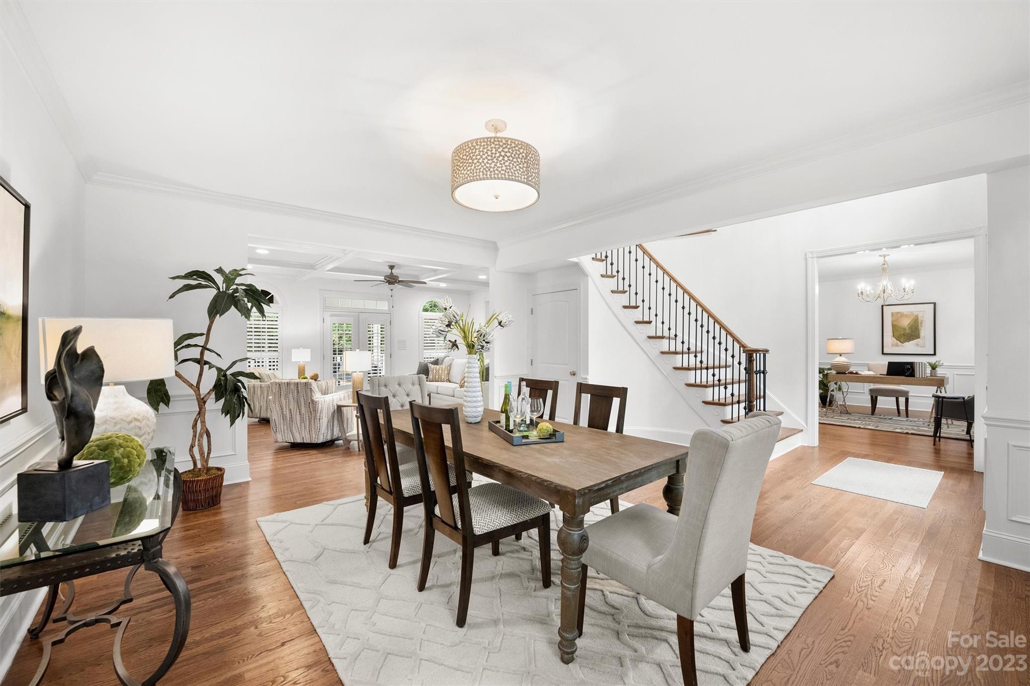 3118 Sharon View Road Charlotte, NC 28210 - Photo 19 of 48 a view of a dining room and livingroom with furniture wooden floor and a rug