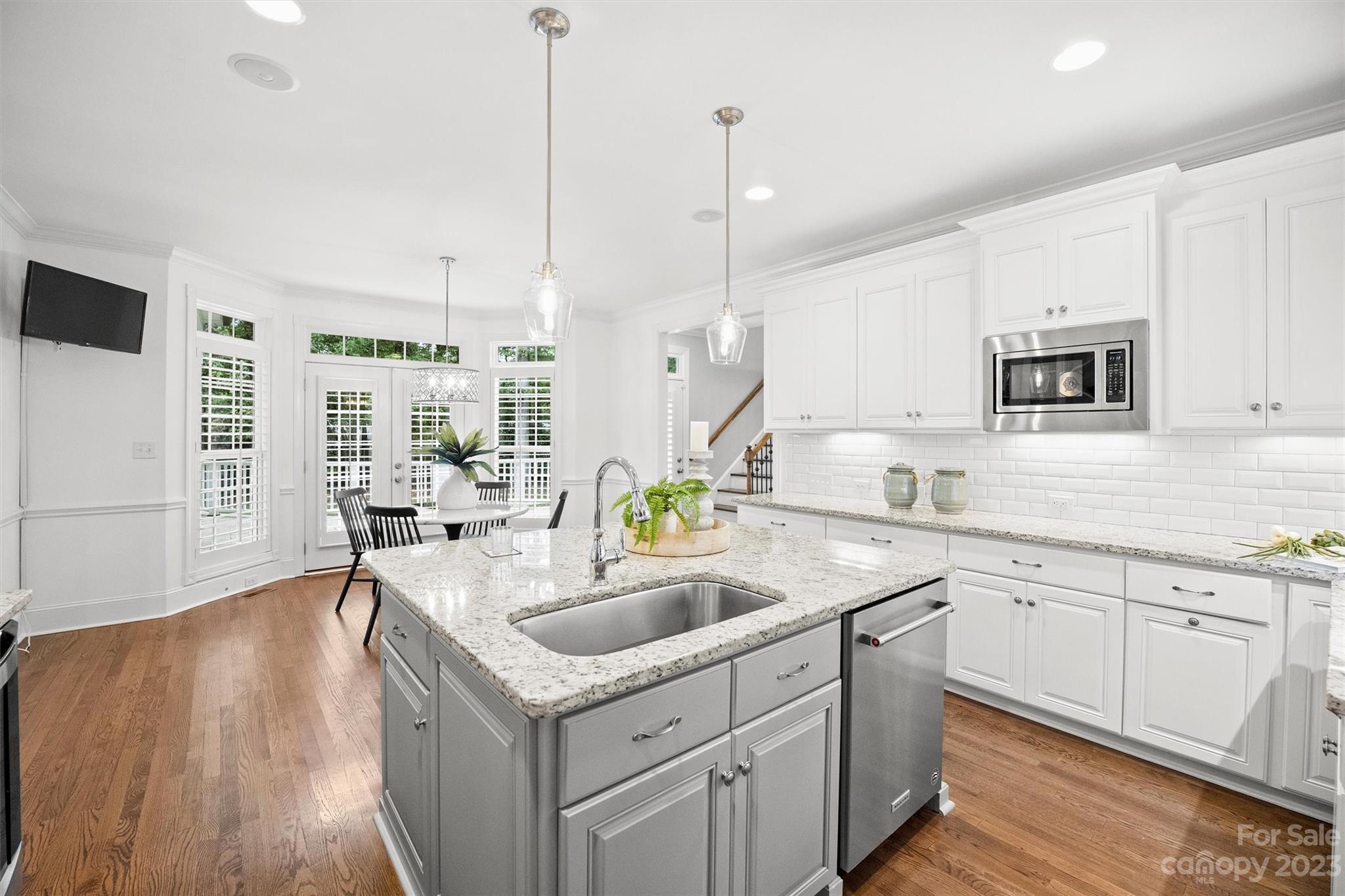 3118 Sharon View Road Charlotte, NC 28210 - Photo 2 of 48 a kitchen with stainless steel appliances granite countertop a sink a stove and a wooden floors