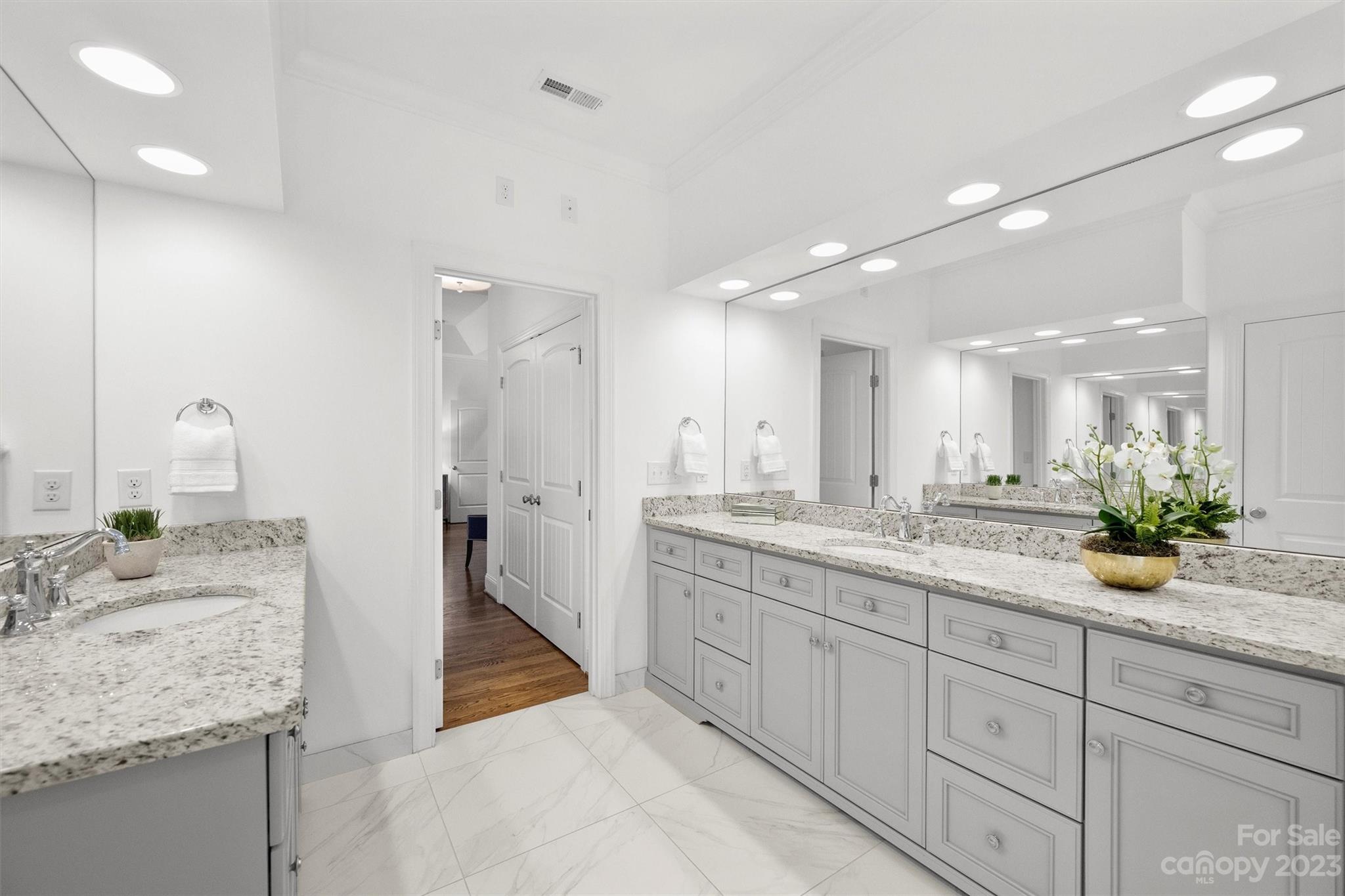 3118 Sharon View Road Charlotte, NC 28210 - Photo 22 of 48 a bathroom with a granite countertop sink a large mirror and a shower