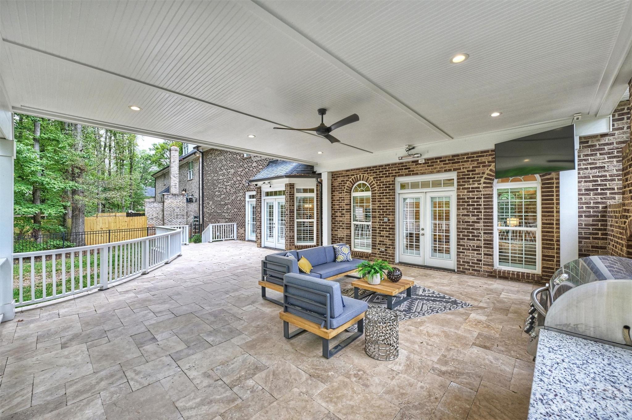 3118 Sharon View Road Charlotte, NC 28210 - Photo 23 of 48 a living room with furniture and floor to ceiling windows