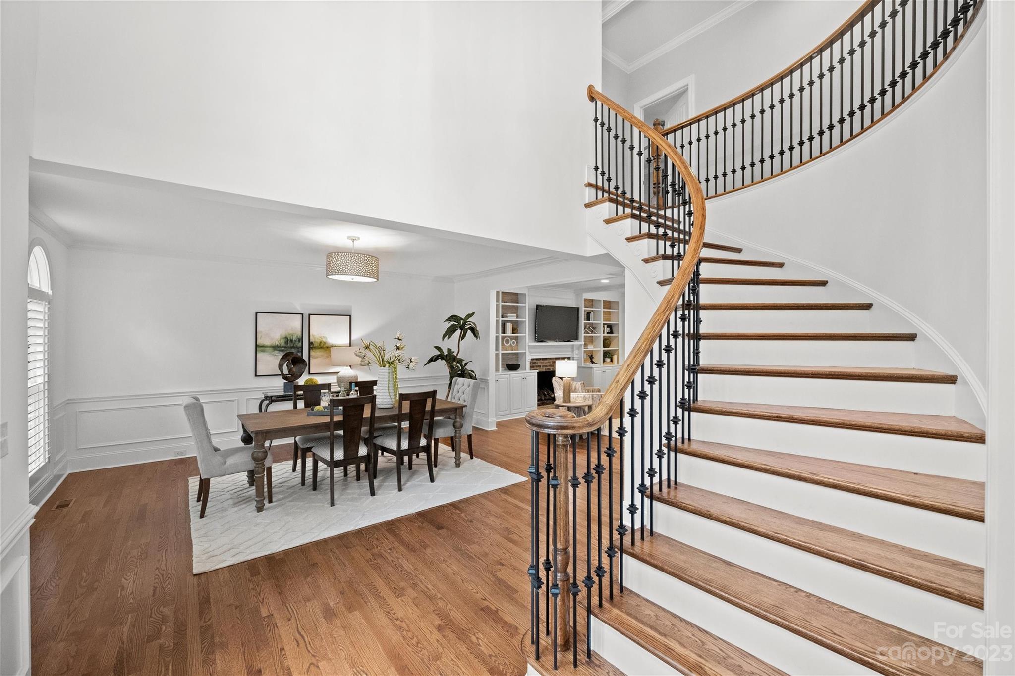 3118 Sharon View Road Charlotte, NC 28210 - Photo 26 of 48 a view of a dining room with wooden floor and a chandelier