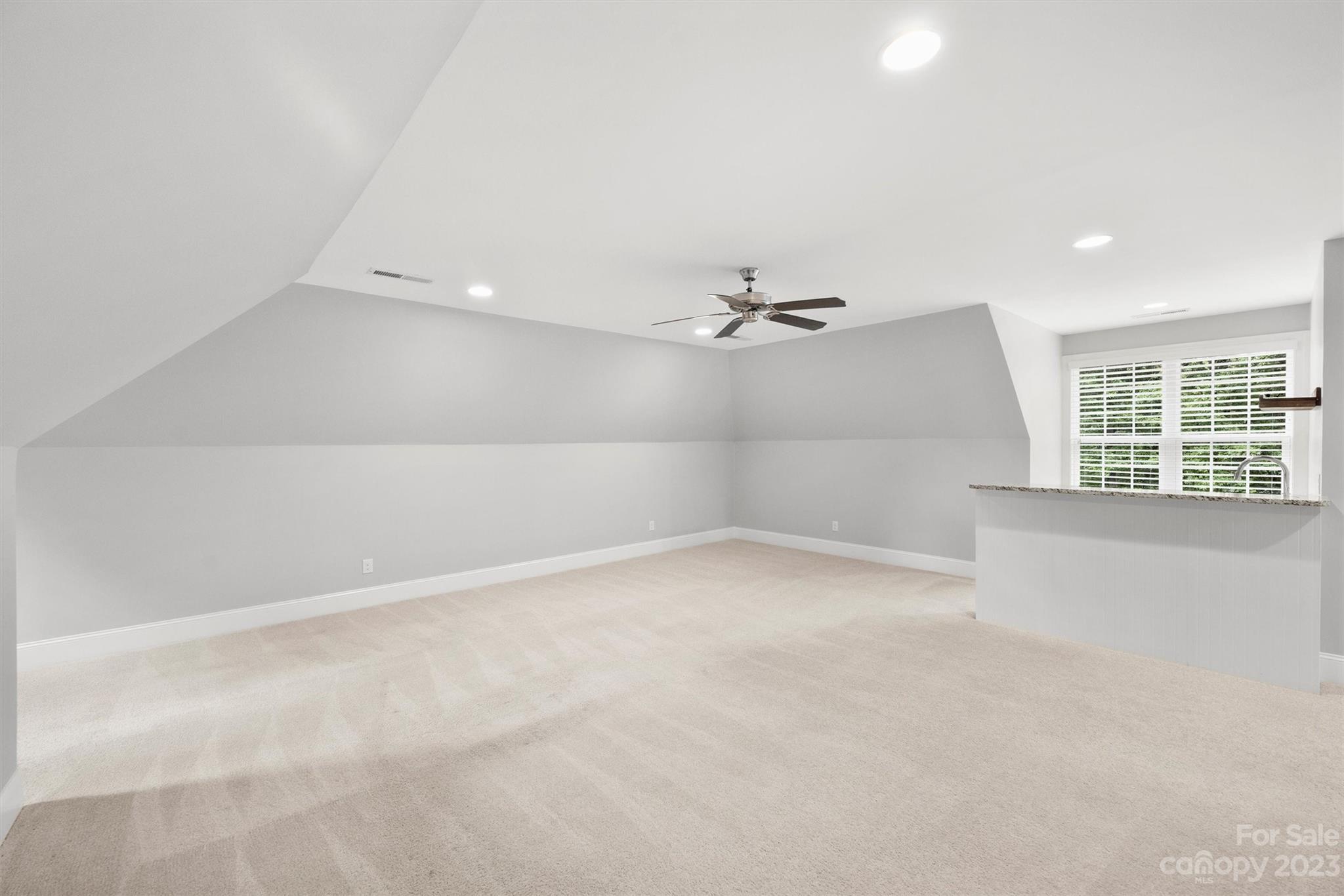 3118 Sharon View Road Charlotte, NC 28210 - Photo 29 of 48 an empty room with windows and fan