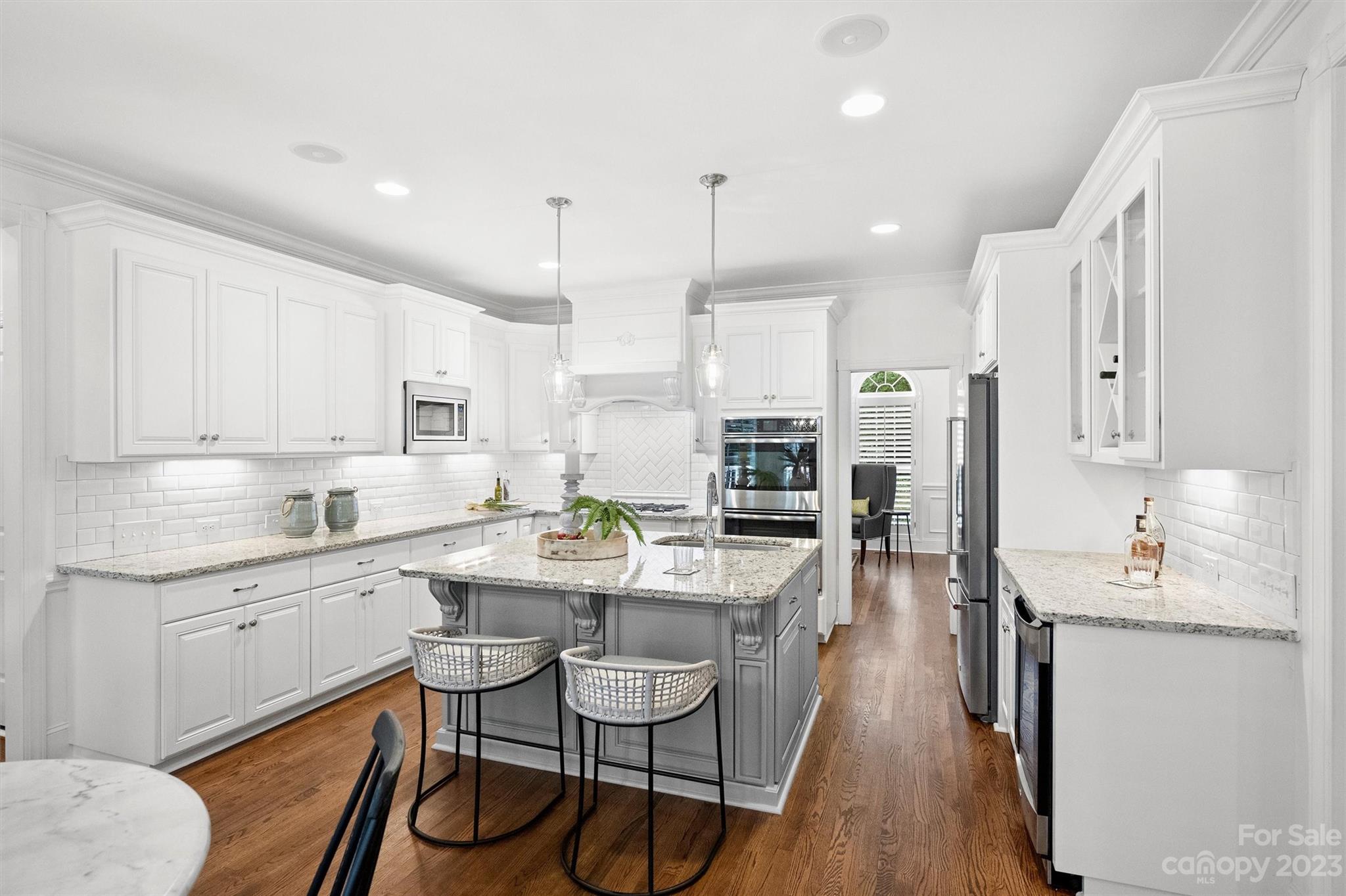 3118 Sharon View Road Charlotte, NC 28210 - Photo 35 of 48 a kitchen with stainless steel appliances kitchen island granite countertop a sink and cabinets