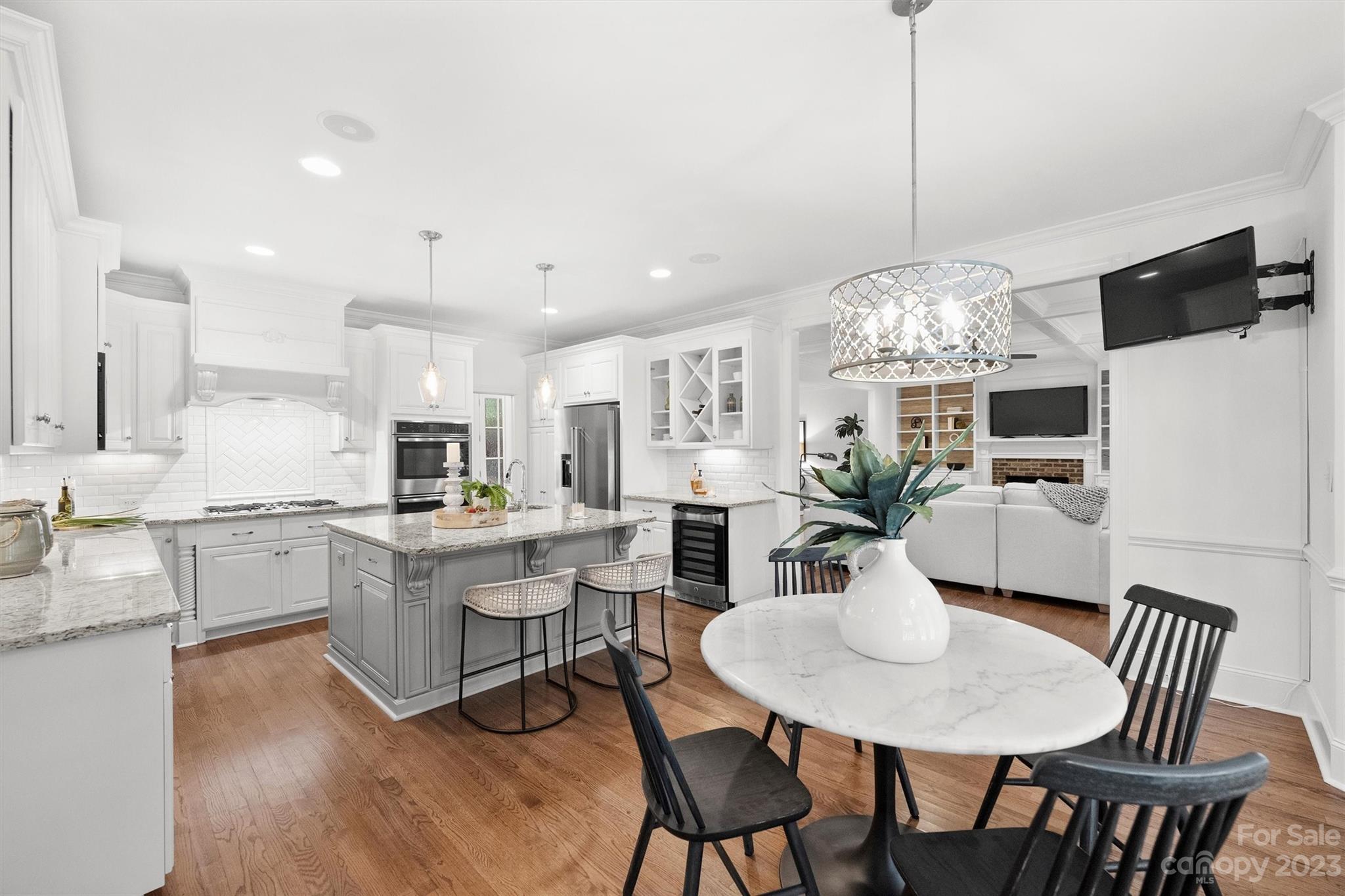 3118 Sharon View Road Charlotte, NC 28210 - Photo 36 of 48 a view of a dining room with furniture a livingroom and chandelier