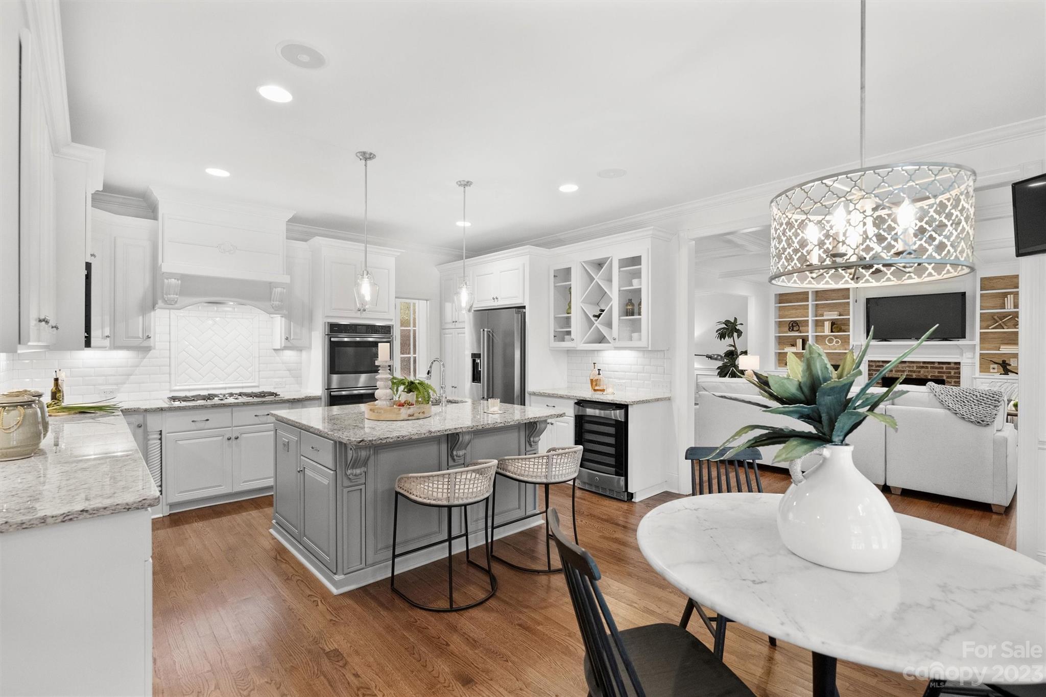 3118 Sharon View Road Charlotte, NC 28210 - Photo 37 of 48 a kitchen with stainless steel appliances granite countertop a stove a sink a refrigerator dining table and chairs