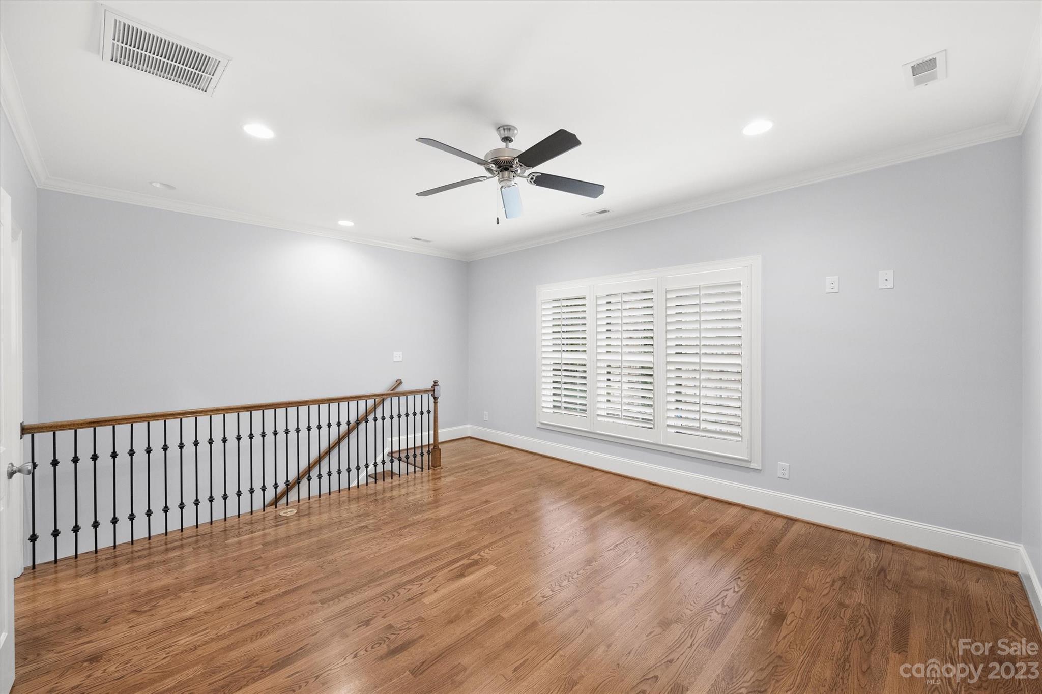 3118 Sharon View Road Charlotte, NC 28210 - Photo 44 of 48 a view of an empty room with wooden floor and a window