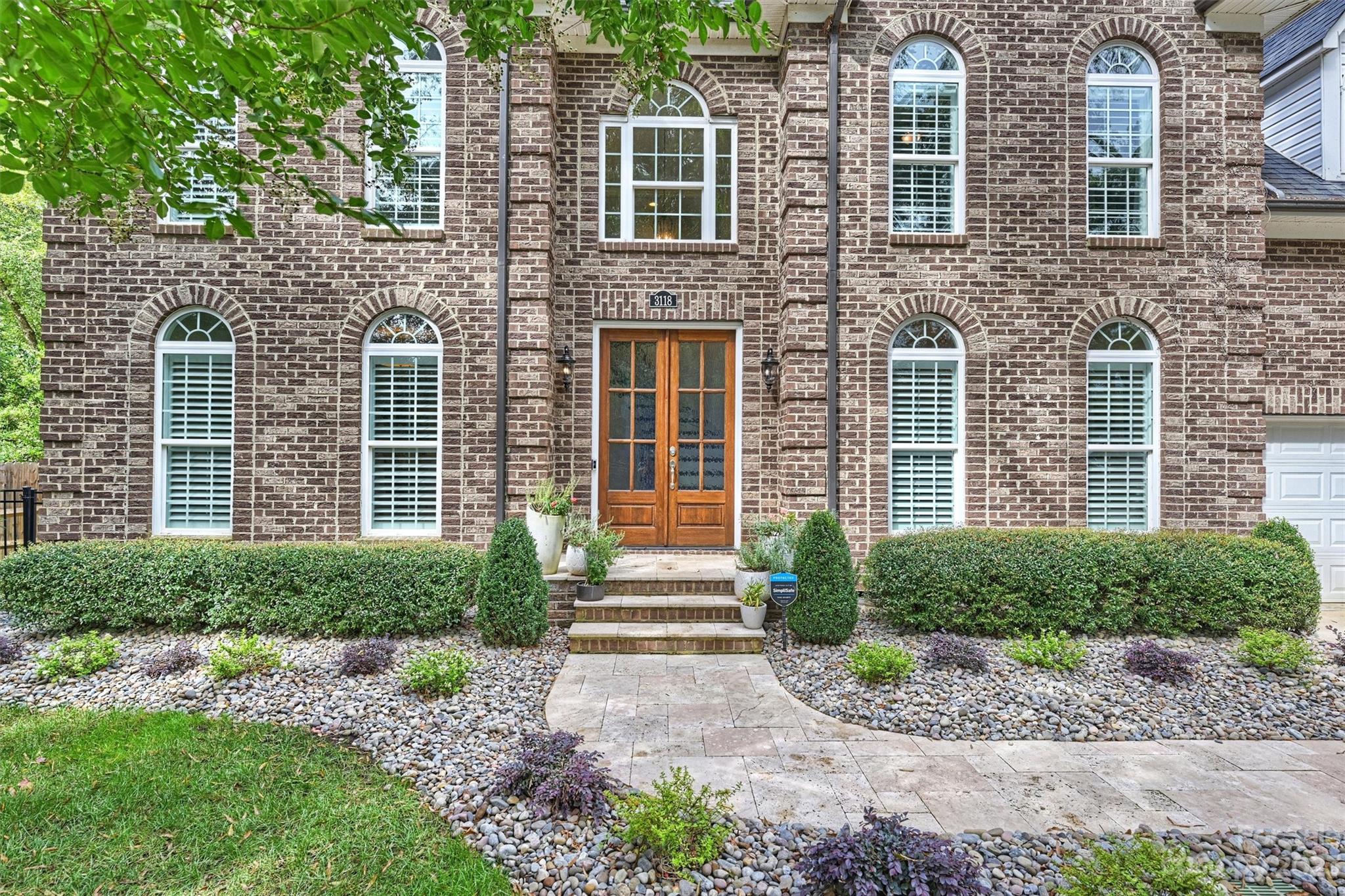 3118 Sharon View Road Charlotte, NC 28210 - Photo 45 of 48 a front view of a house with a yard and outdoor seating
