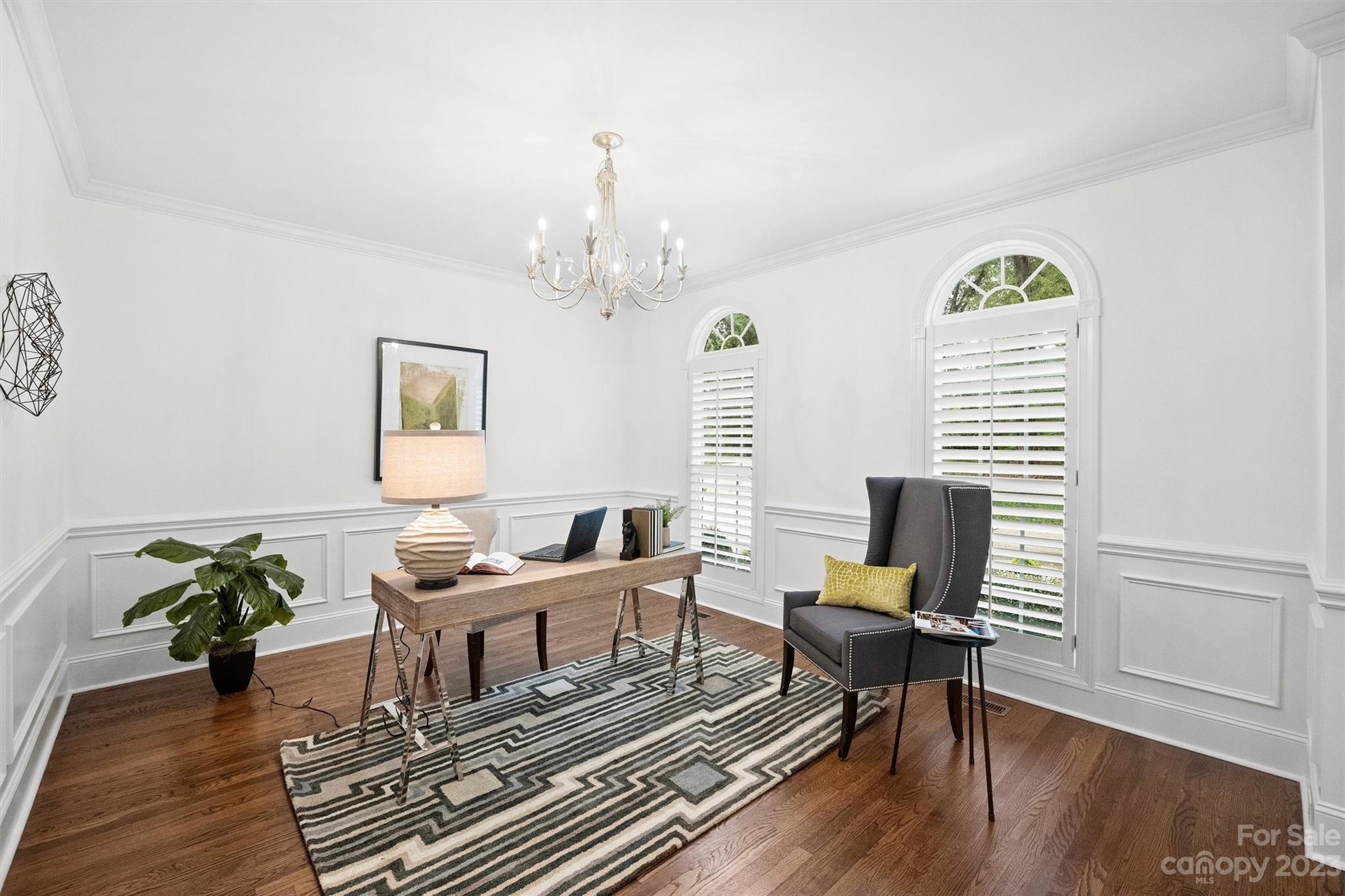 3118 Sharon View Road Charlotte, NC 28210 - Photo 9 of 48 a living room with furniture a chandelier and a window