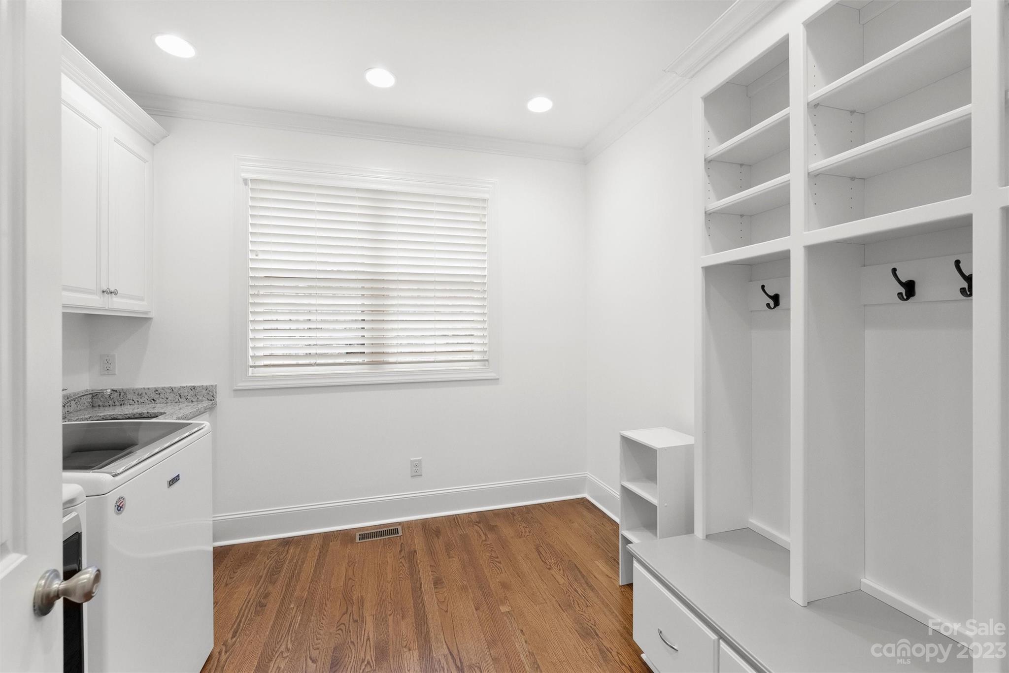 3118 Sharon View Road Charlotte, NC 28210 - Photo 10 of 48 a view of an empty room with a window and wooden floor