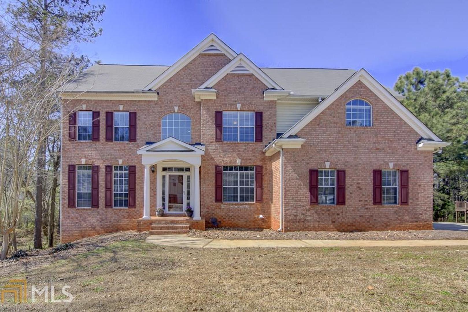 100 Saddle Ridge Way Fayetteville, GA 30215 - Photo 1 of 1 a front view of a house with garden