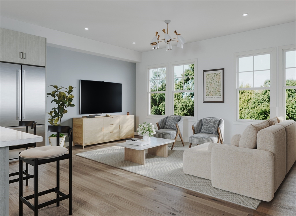 176 School Street, Unit 1 Boston, MA 02130 - Photo 2 of 5 a living room with furniture and a flat screen tv
