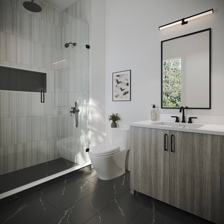 176 School Street, Unit 1 Boston, MA 02130 - Photo 4 of 5 a bathroom with a sink a toilet and shower