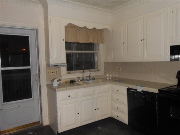 23 Greenbrier Street Springfield, MA 01108 - Photo 2 of 12 a kitchen with a sink and a microwave