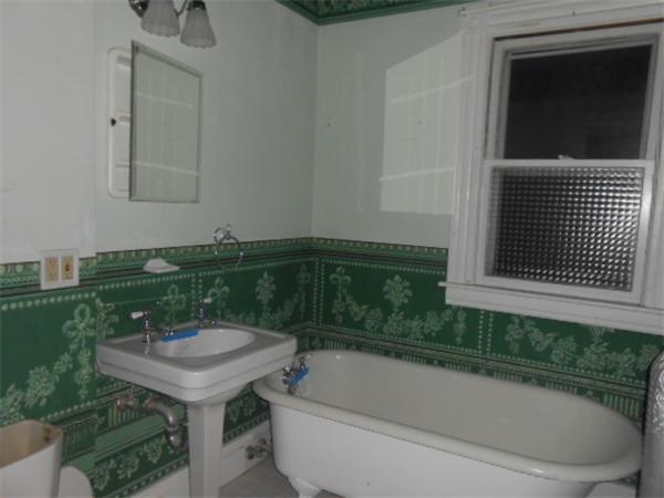 23 Greenbrier Street Springfield, MA 01108 - Photo 7 of 12 a bathroom with a sink and bathtub