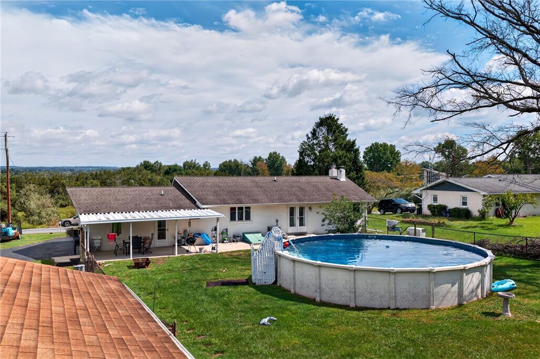 1307 Klinerd Road Pennsburg, PA 18073 - Photo 39 of 53 A spacious backyard setting provides a private swimming pool and a covered patio area.