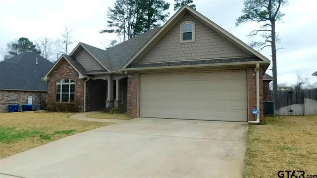 a front view of a house with a garage