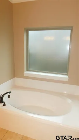 a bathroom with a glass door