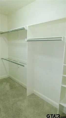 a view of a house with yard and porch