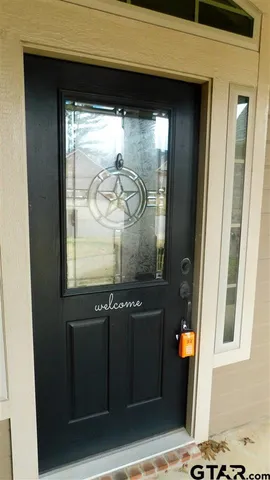 a view of a door and a window