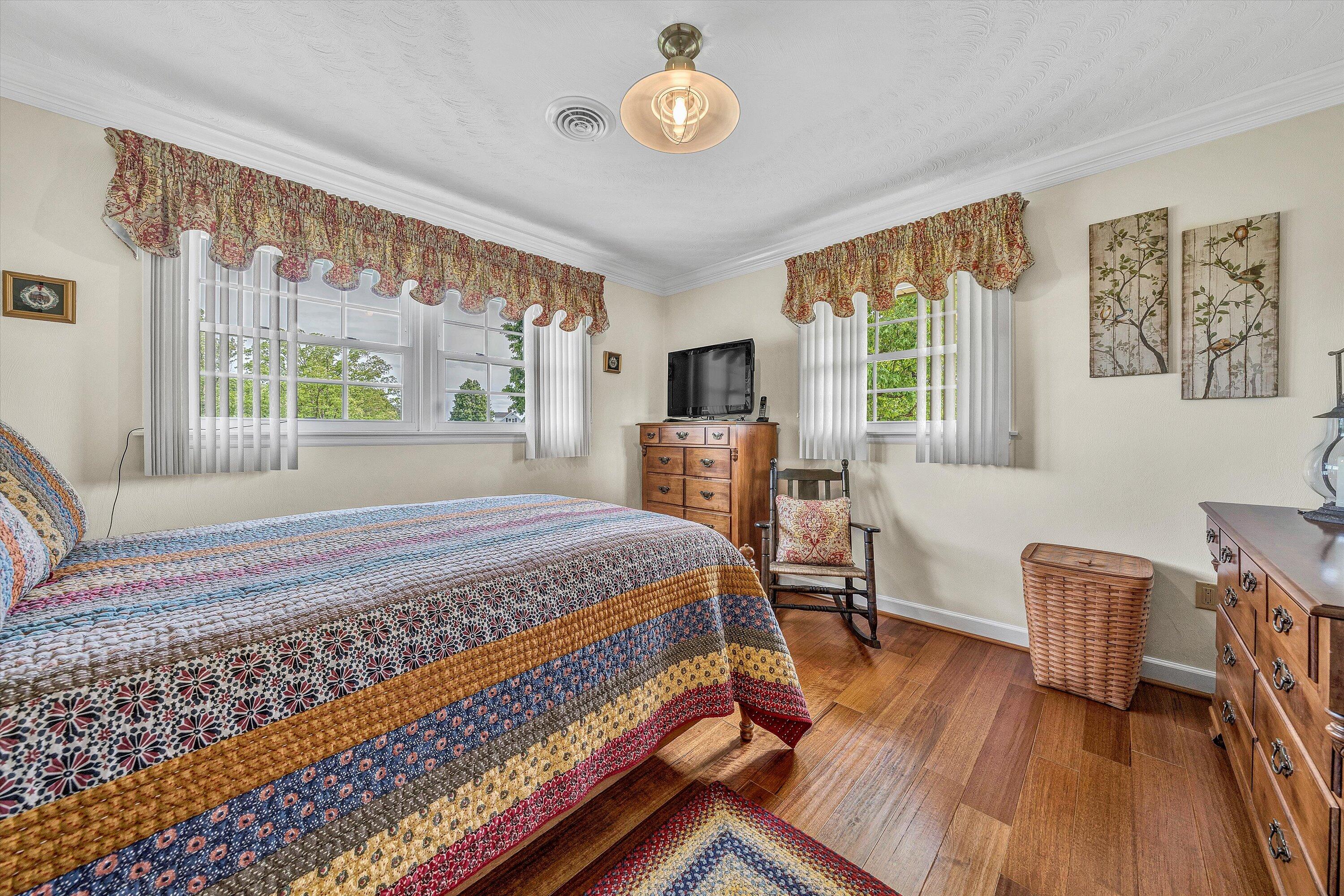 3229 Morgans Mill Road Goodview, VA 24095 - Photo 19 of 60 a bedroom with furniture and a window