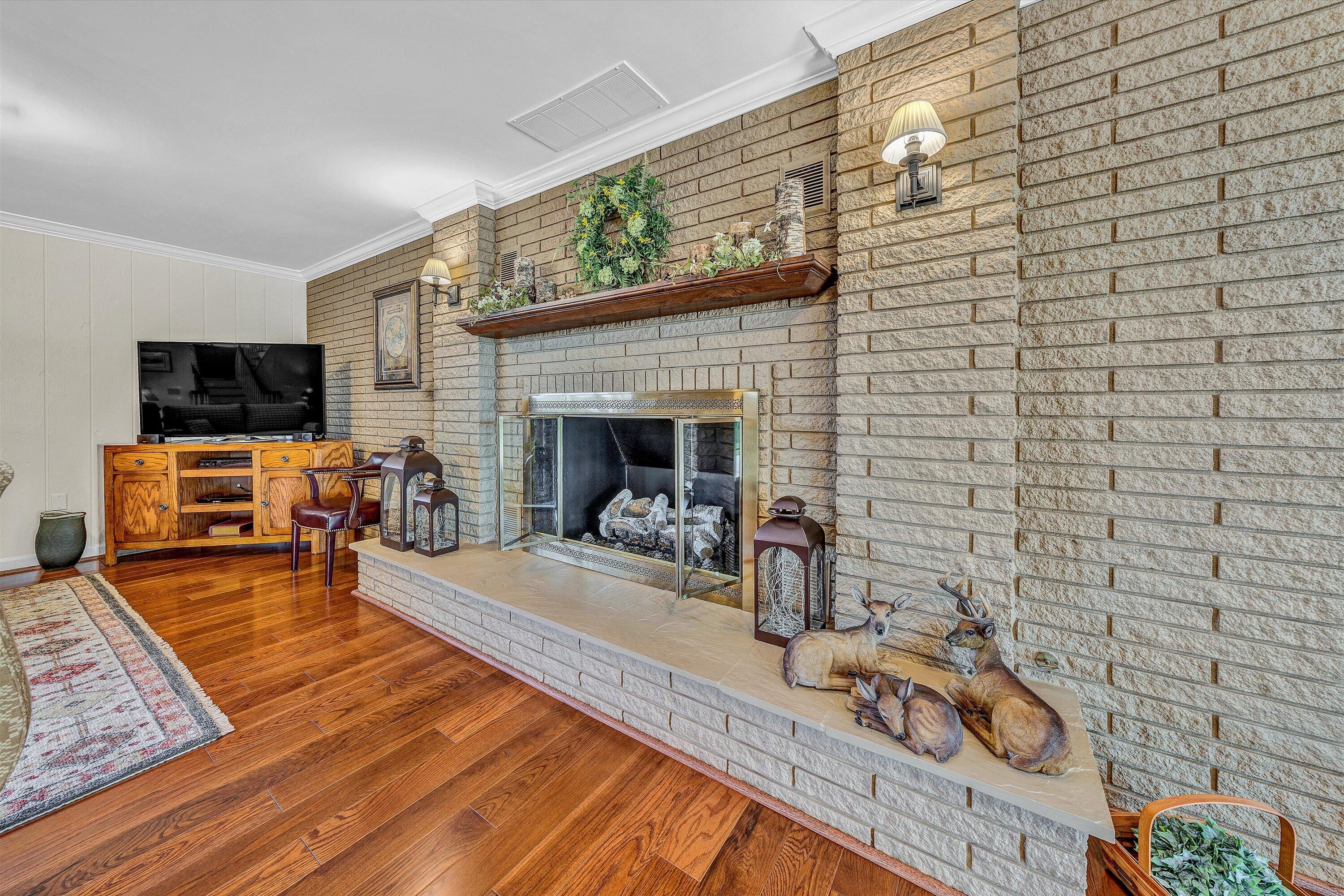 3229 Morgans Mill Road Goodview, VA 24095 - Photo 25 of 60 a living room with furniture and a fireplace