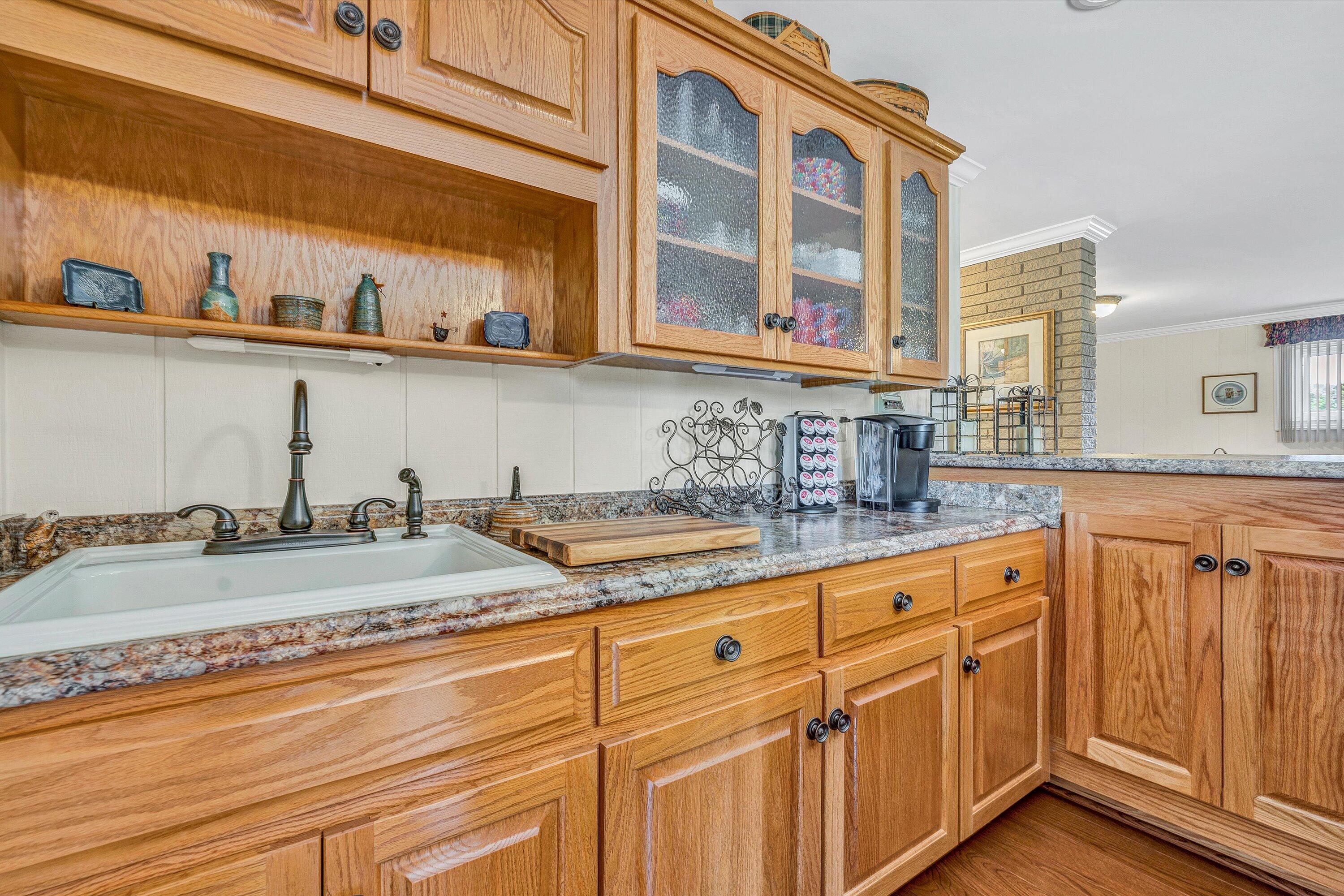 3229 Morgans Mill Road Goodview, VA 24095 - Photo 27 of 60 a kitchen with stainless steel appliances granite countertop a sink and cabinets