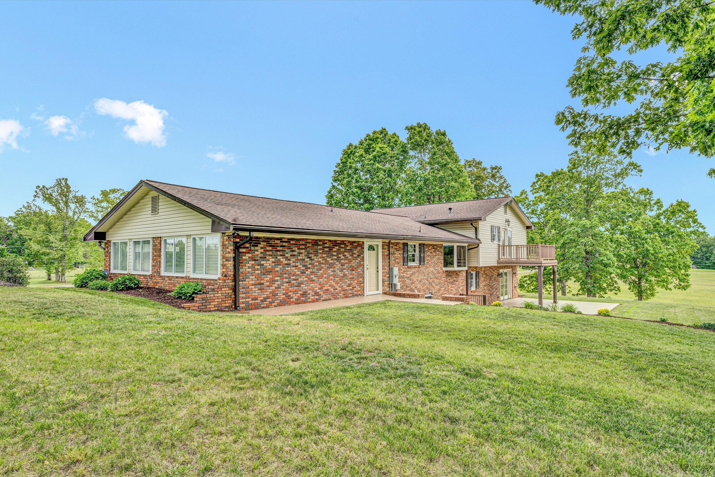 3229 Morgans Mill Road Goodview, VA 24095 - Photo 36 of 60 a view of a house with a yard