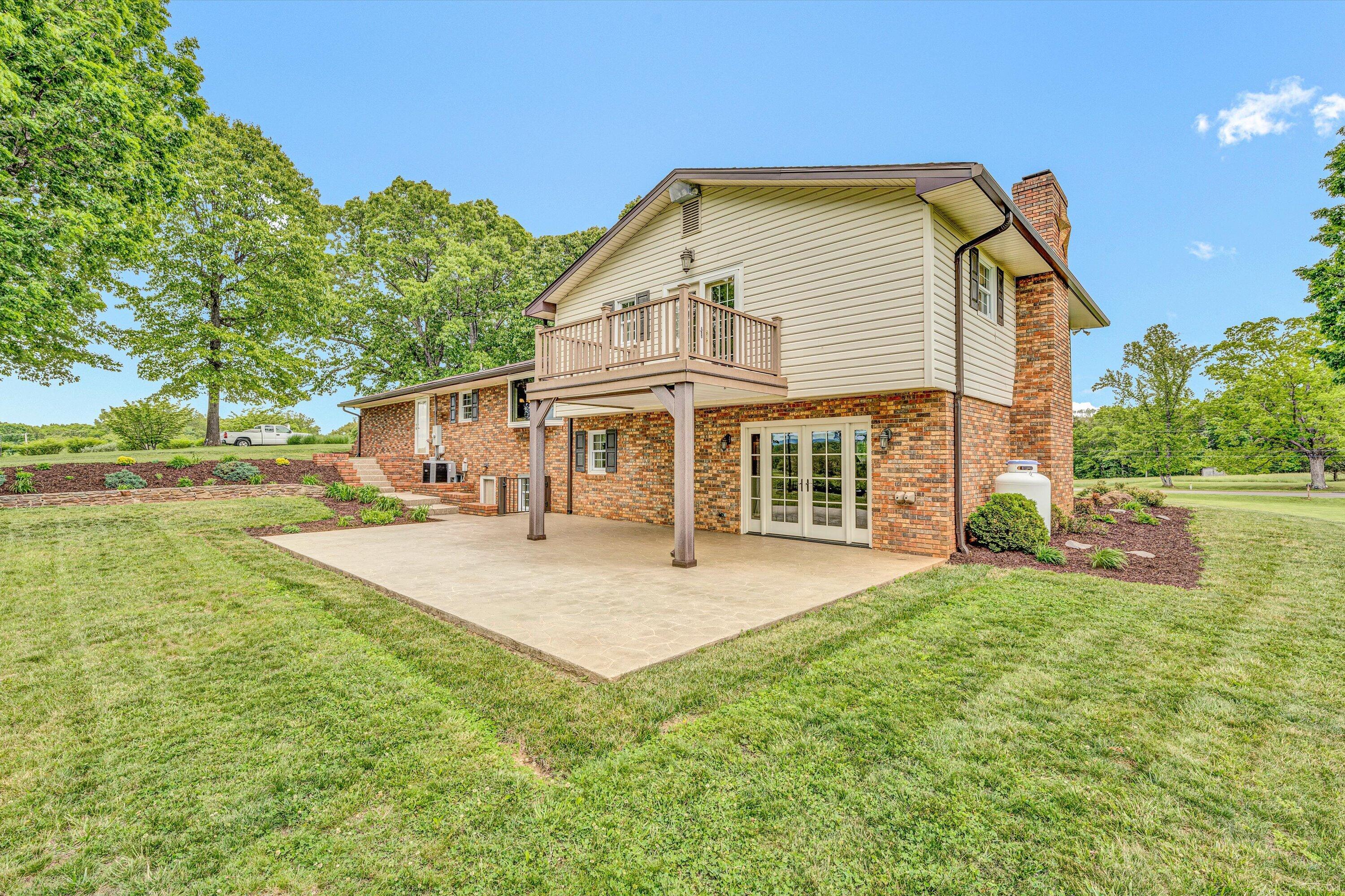 3229 Morgans Mill Road Goodview, VA 24095 - Photo 39 of 60 a front view of a house with a yard