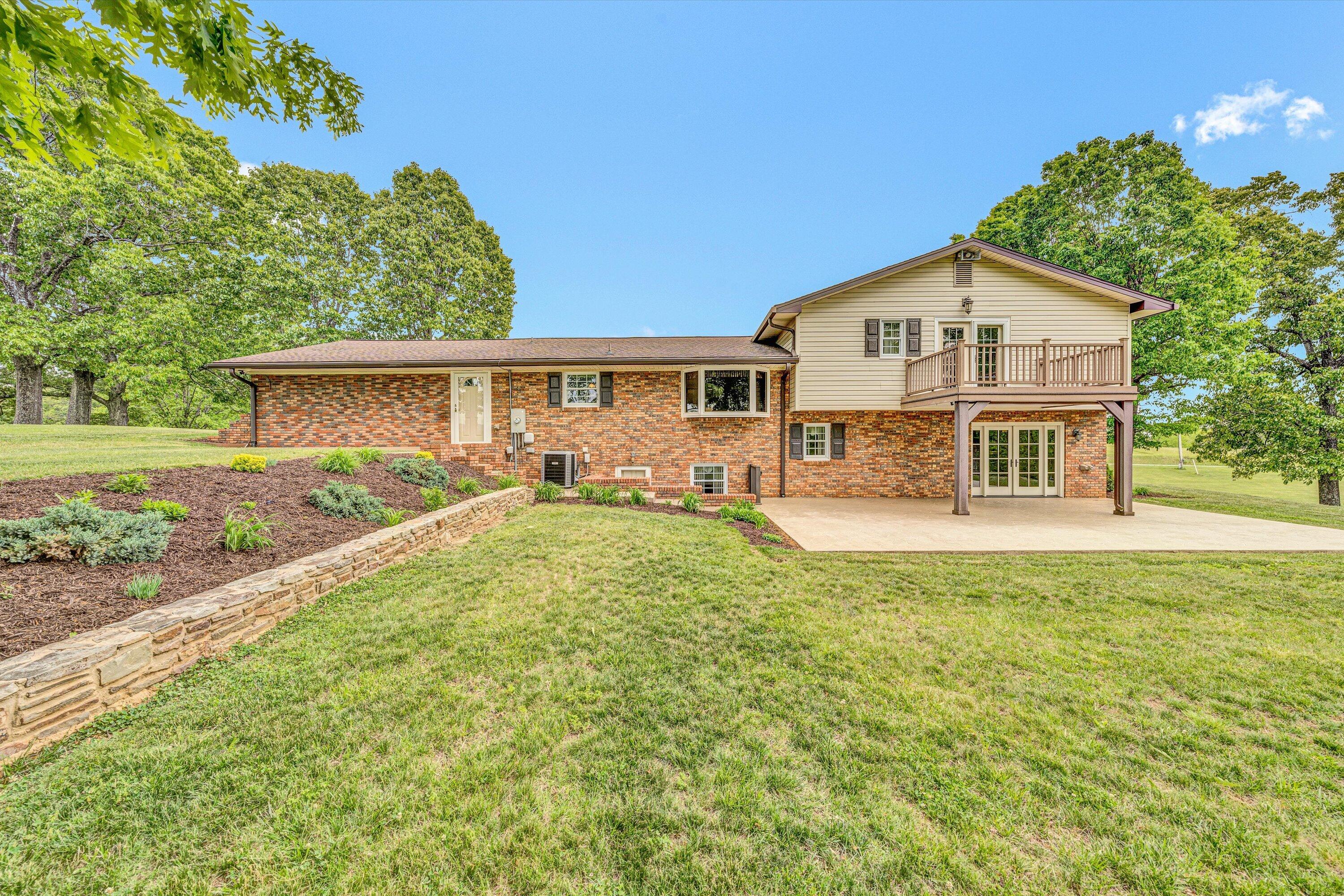 3229 Morgans Mill Road Goodview, VA 24095 - Photo 40 of 60 a view of a house with a yard and sitting area