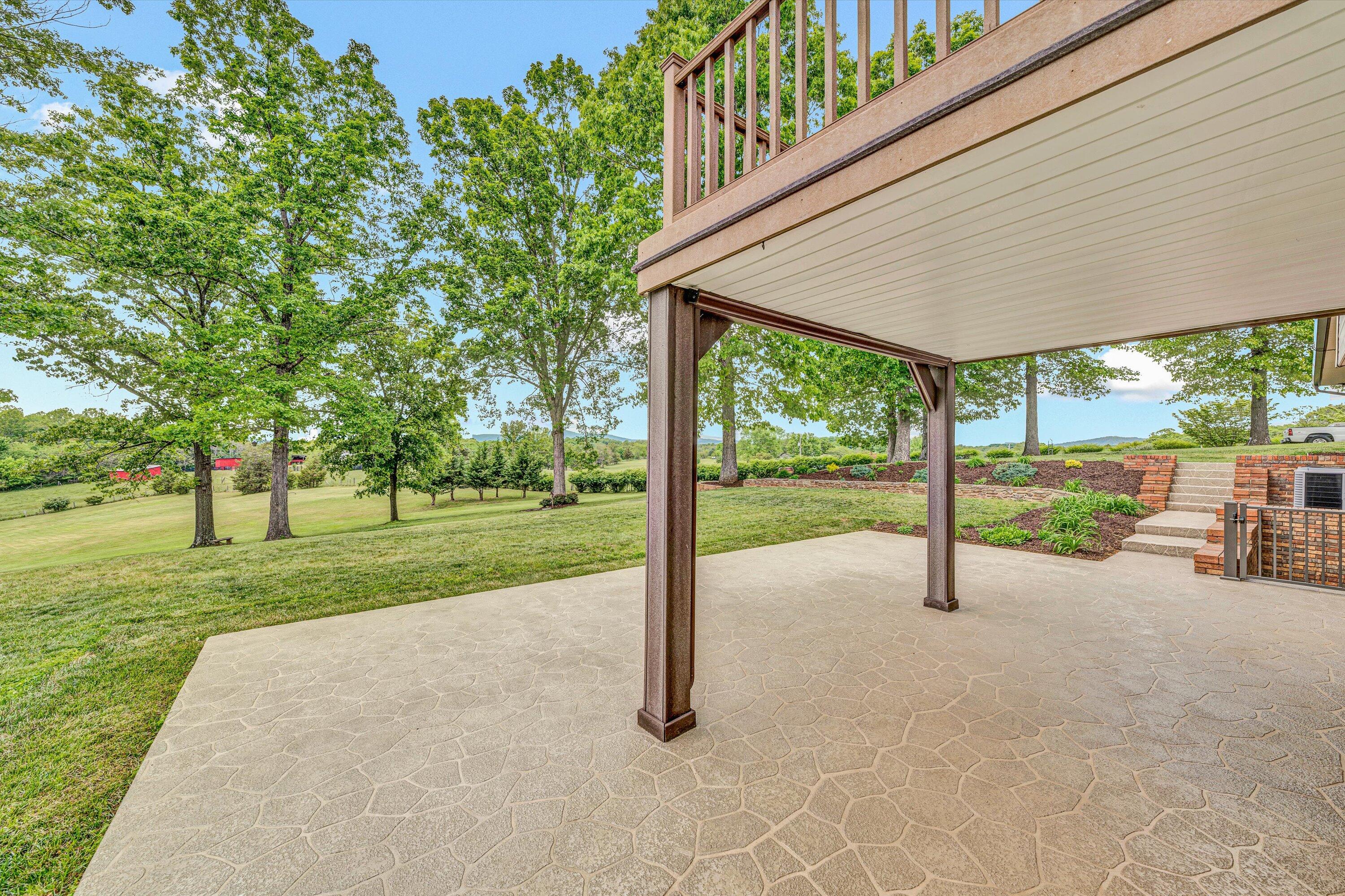 3229 Morgans Mill Road Goodview, VA 24095 - Photo 41 of 60 a view of a house with backyard and couches