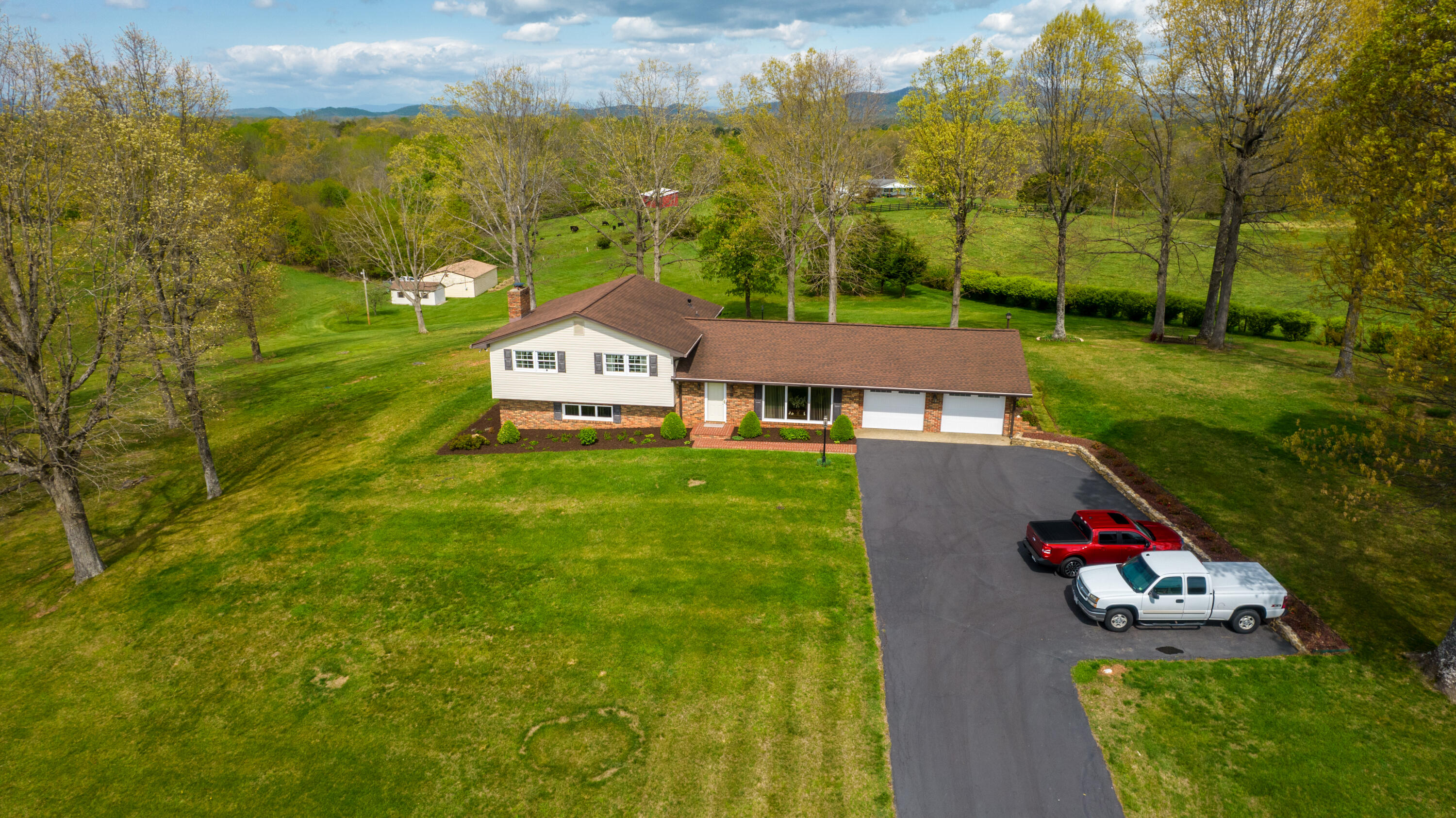 3229 Morgans Mill Road Goodview, VA 24095 - Photo 55 of 60 an aerial view of residential houses with outdoor space and trees