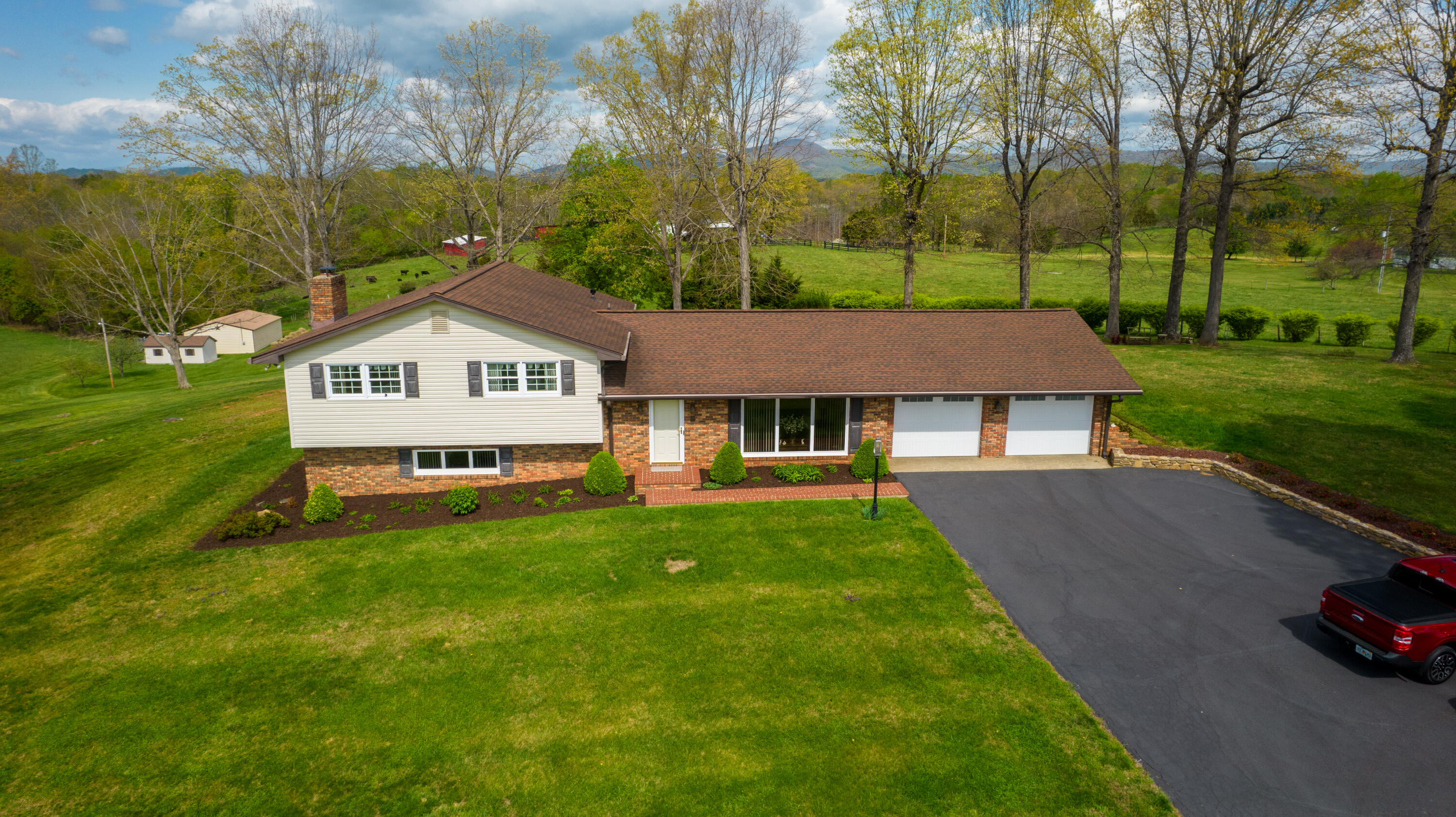 3229 Morgans Mill Road Goodview, VA 24095 - Photo 56 of 60 a view of a house with a yard