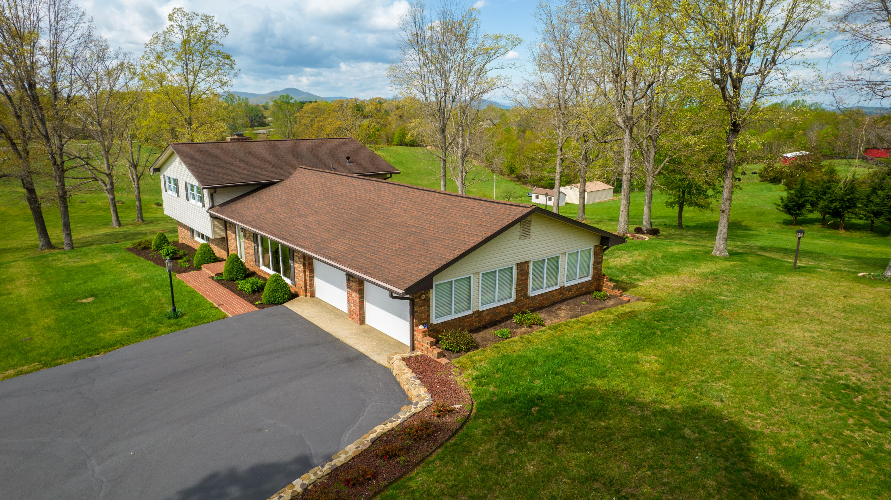 3229 Morgans Mill Road Goodview, VA 24095 - Photo 57 of 60 a view of a house with a yard