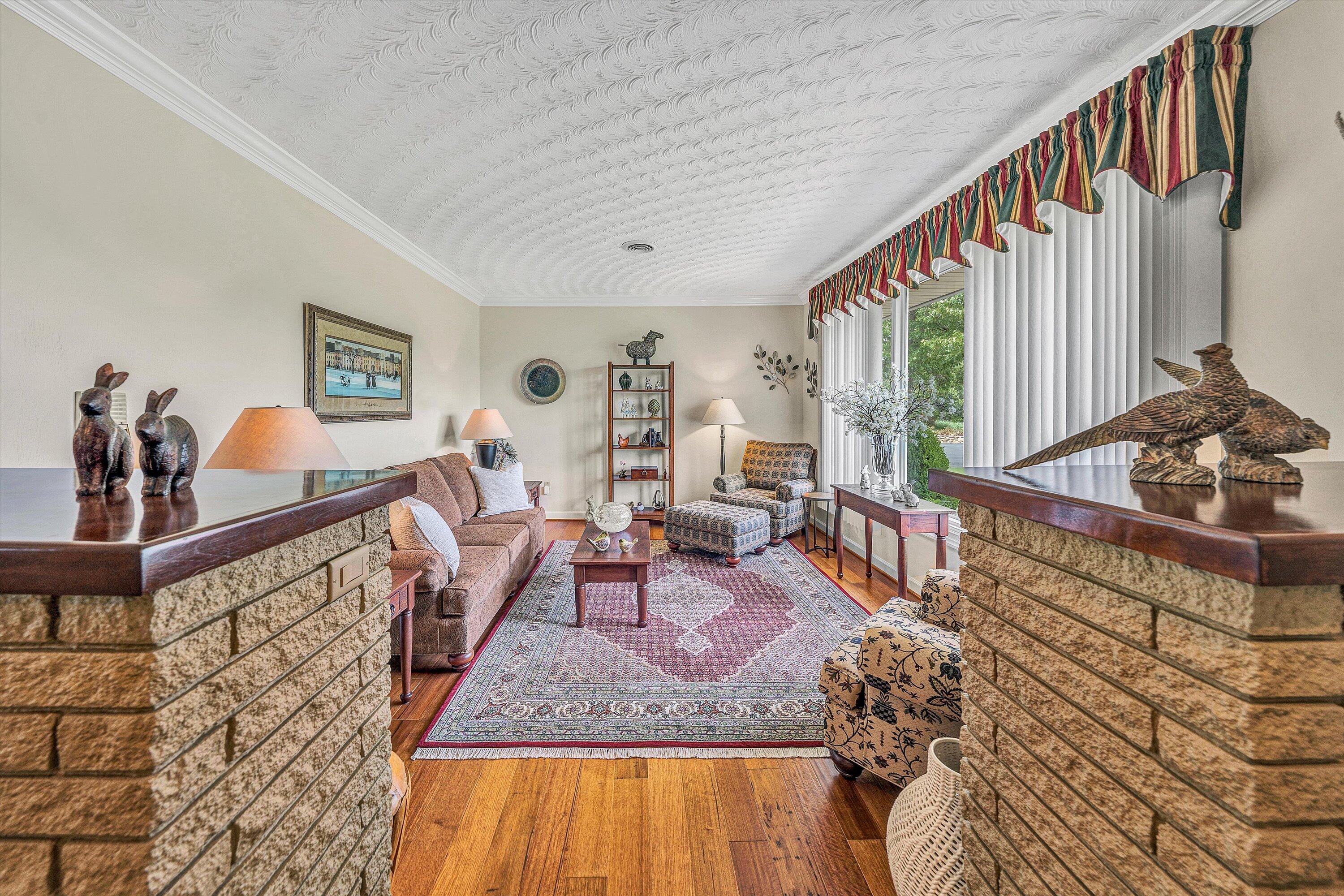 3229 Morgans Mill Road Goodview, VA 24095 - Photo 6 of 60 a living room with furniture and a wooden floor