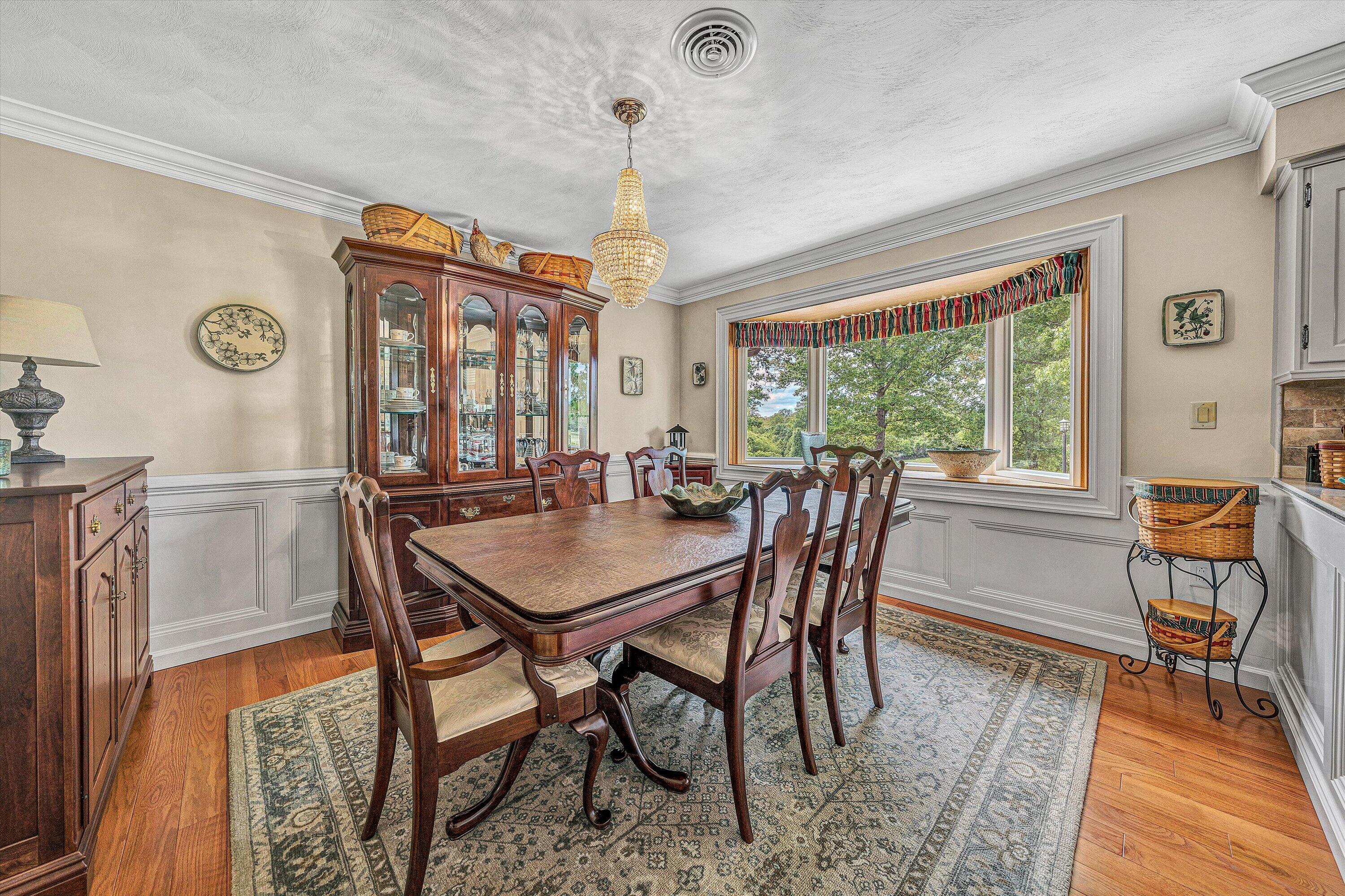 3229 Morgans Mill Road Goodview, VA 24095 - Photo 8 of 60 a view of a dining room with furniture window and wooden floor