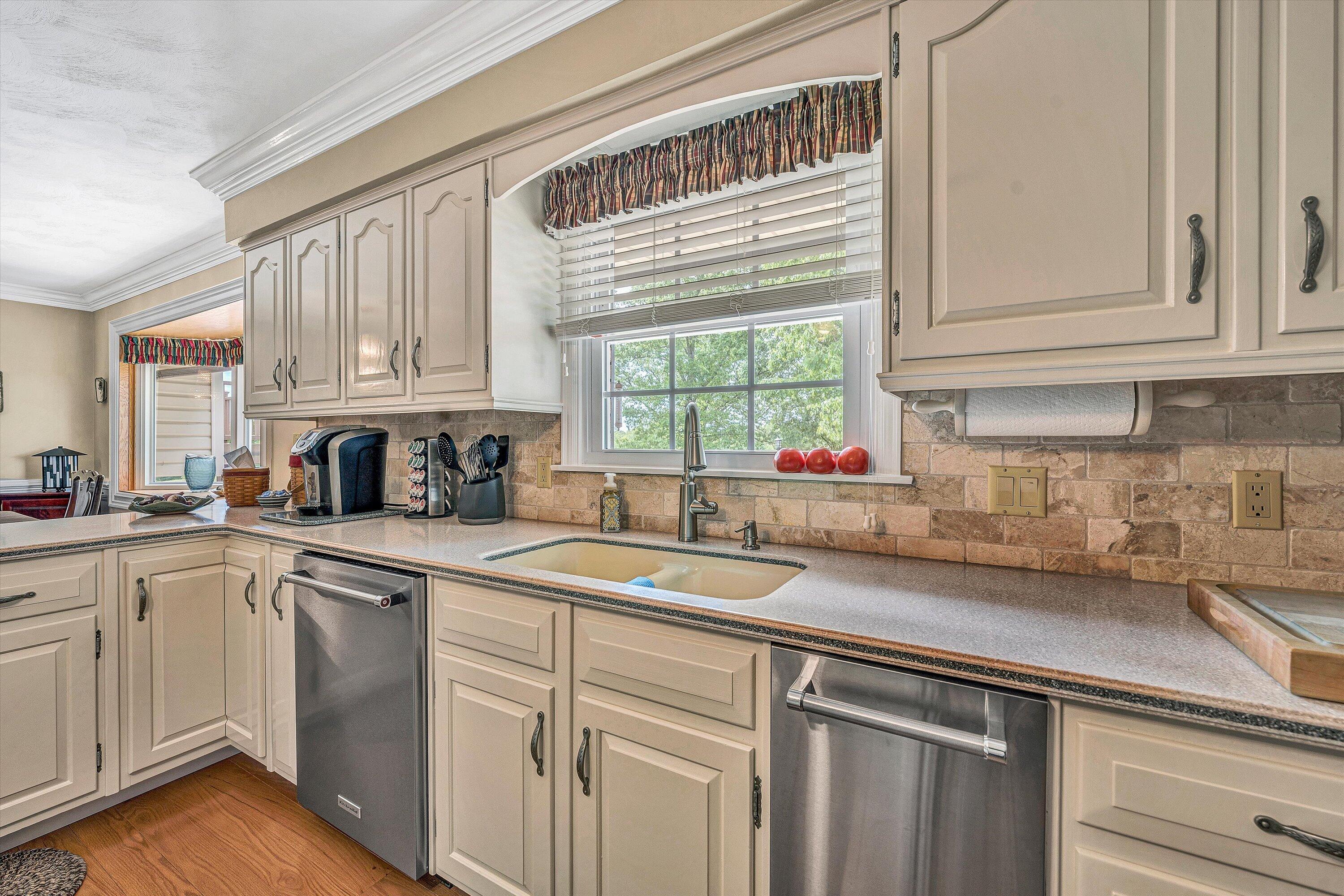 3229 Morgans Mill Road Goodview, VA 24095 - Photo 10 of 60 a kitchen with granite countertop a sink stainless steel appliances and cabinets
