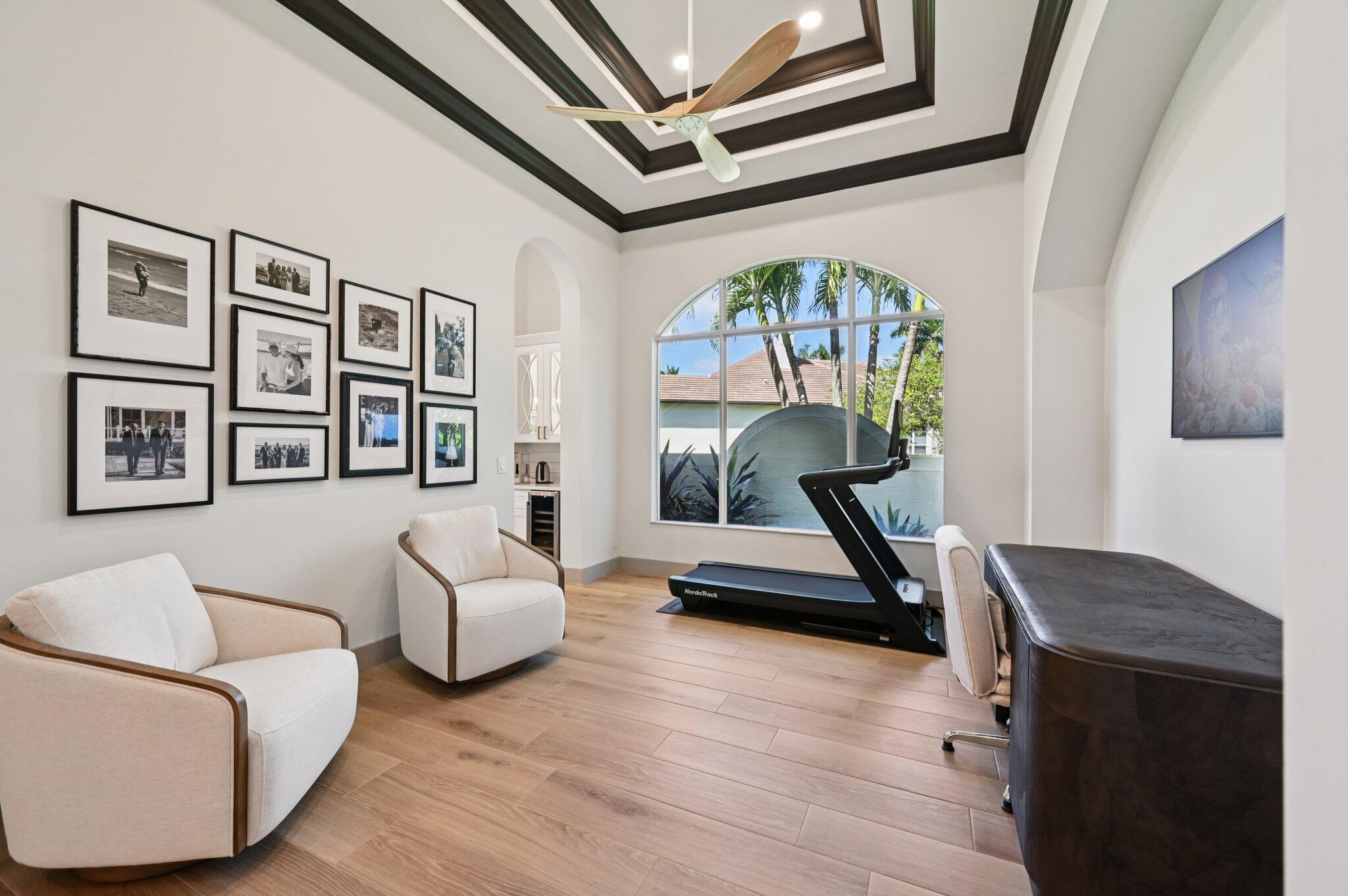 9936 Southeast Sandpine Lane Hobe Sound, FL 33455 - Photo 18 of 71 a living room with furniture and a wooden floor
