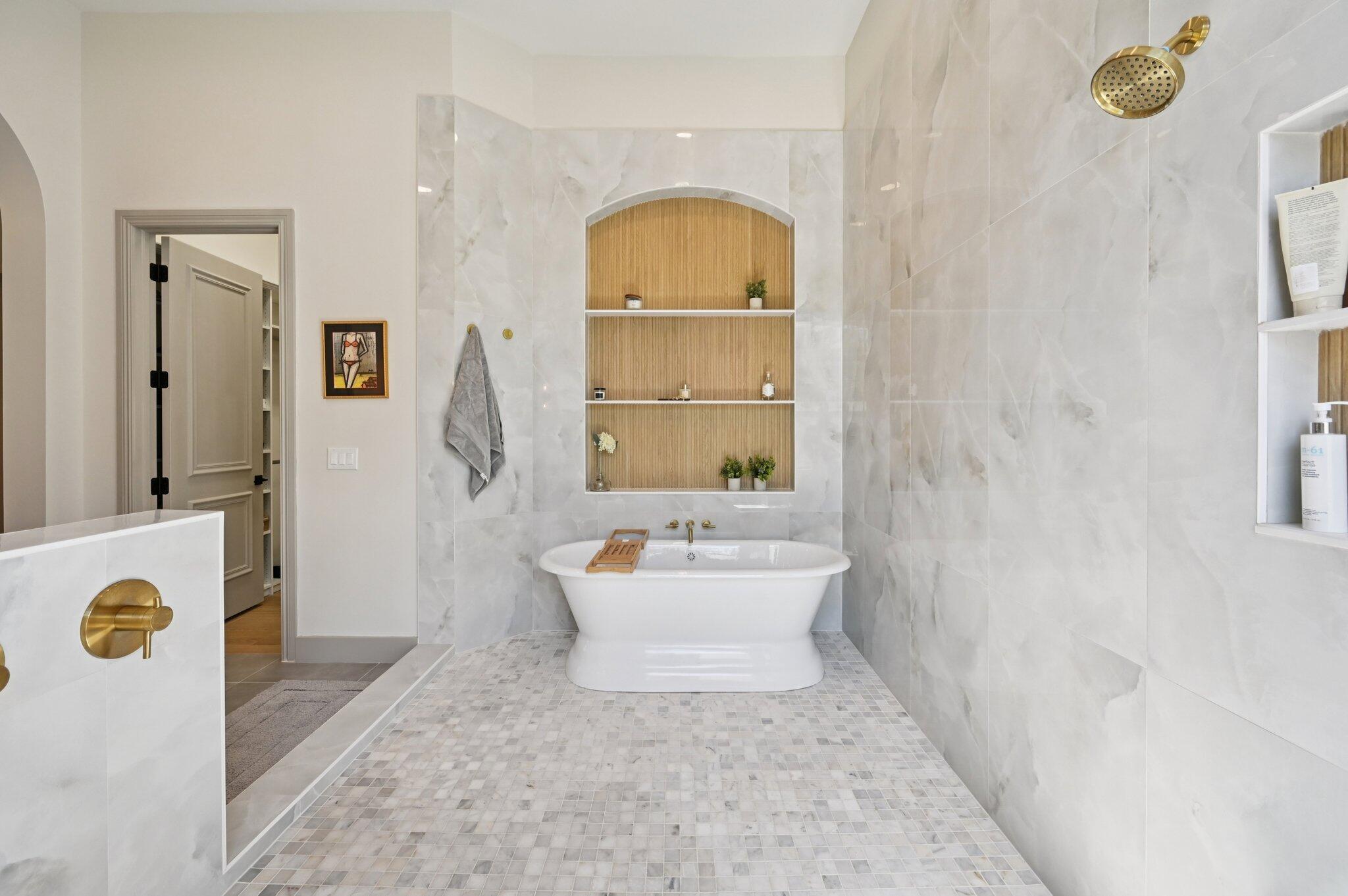 9936 Southeast Sandpine Lane Hobe Sound, FL 33455 - Photo 24 of 71 a bathroom with a sink a mirror and a shower