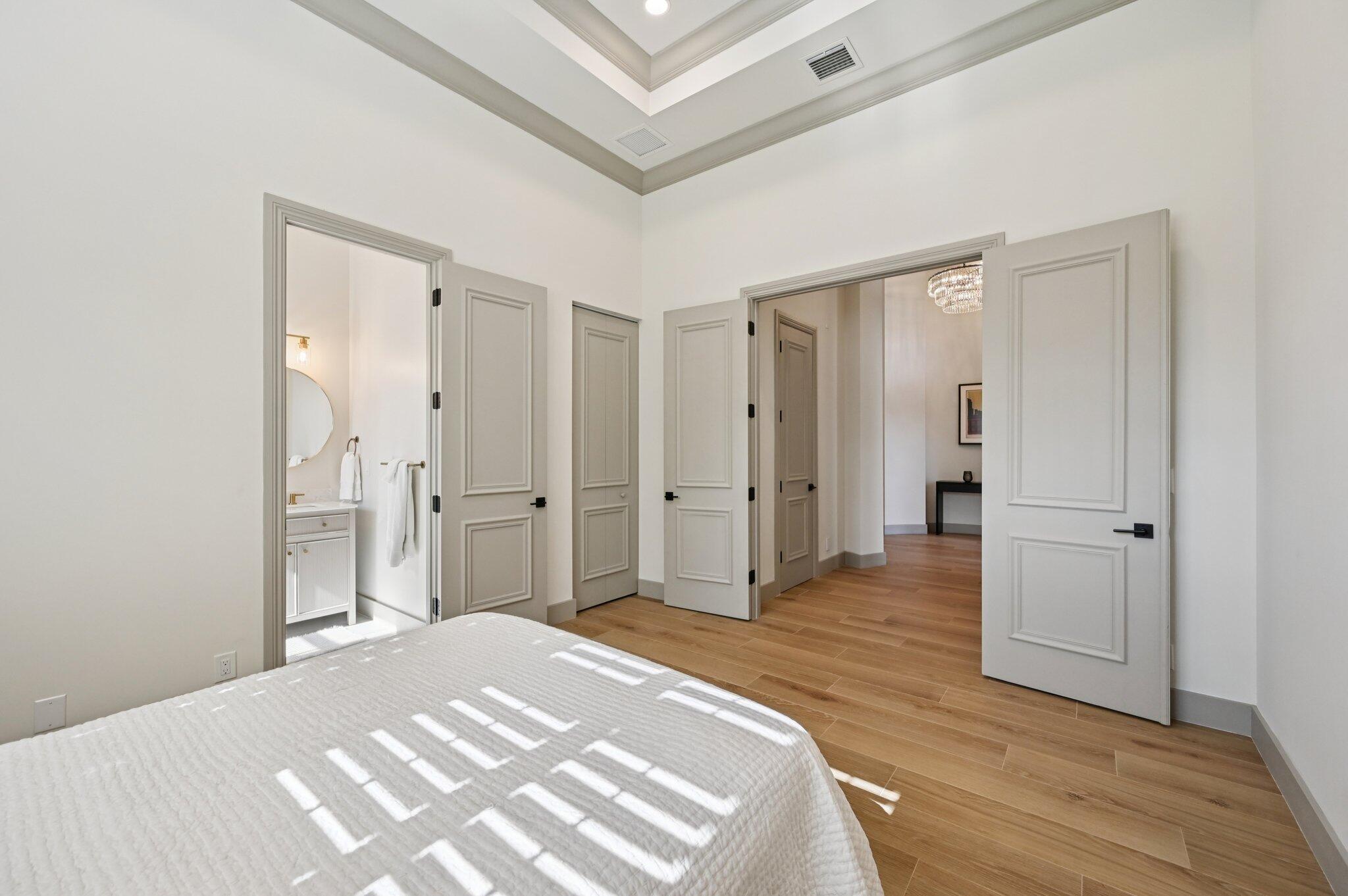 9936 Southeast Sandpine Lane Hobe Sound, FL 33455 - Photo 31 of 71 a spacious bedroom with a bed and a dresser