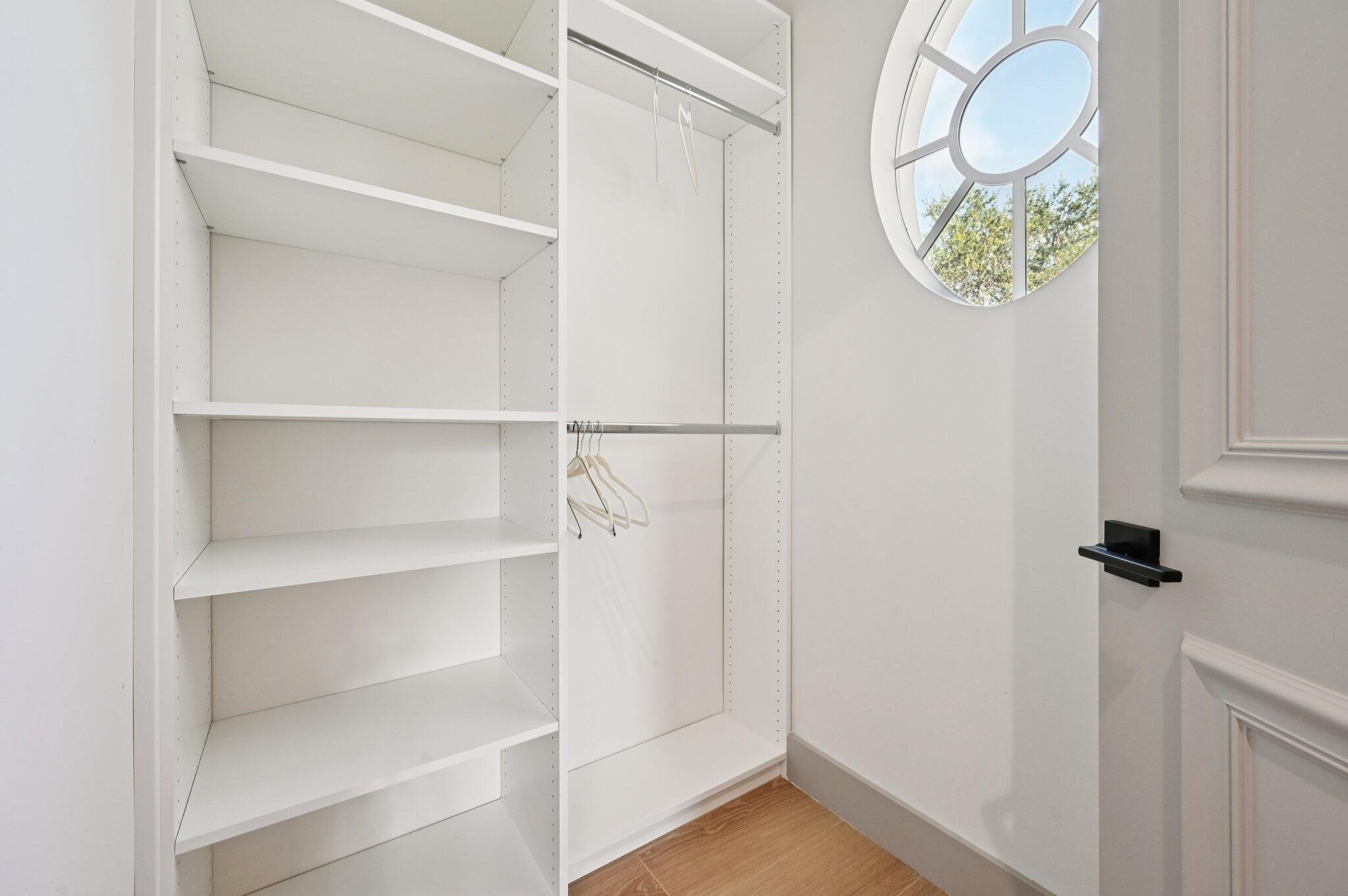 9936 Southeast Sandpine Lane Hobe Sound, FL 33455 - Photo 35 of 71 a view of a room with rack on the wall