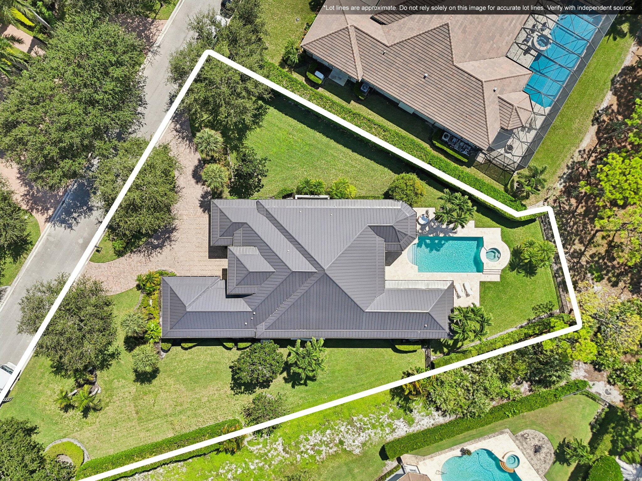 9936 Southeast Sandpine Lane Hobe Sound, FL 33455 - Photo 45 of 71 an aerial view of house with a yard