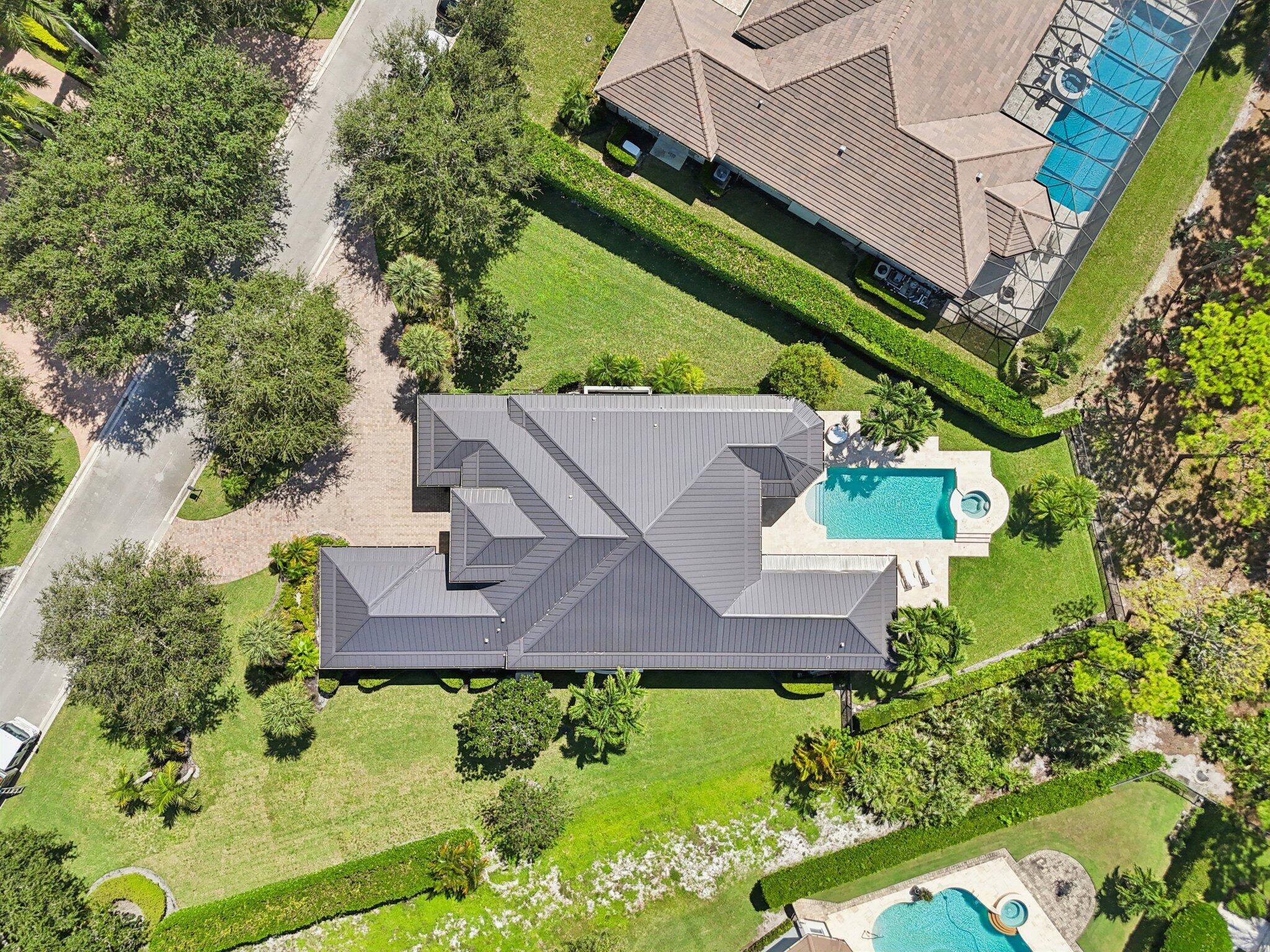 9936 Southeast Sandpine Lane Hobe Sound, FL 33455 - Photo 52 of 71 an aerial view of house with yard swimming pool and outdoor seating