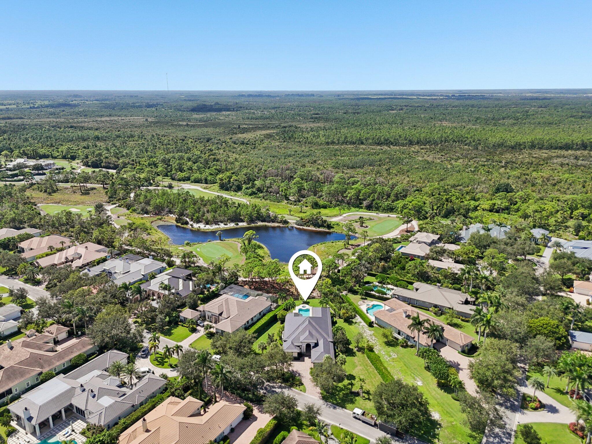 9936 Southeast Sandpine Lane Hobe Sound, FL 33455 - Photo 56 of 71 an aerial view of residential house with outdoor space