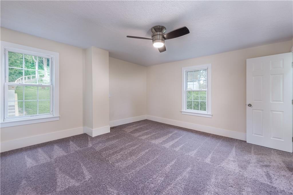 701 Main Street Irwin, PA 15642 - Photo 13 of 37 a view of an empty room with a window