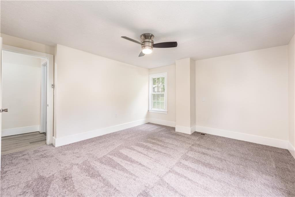 701 Main Street Irwin, PA 15642 - Photo 14 of 37 a view of empty room with ceiling fan