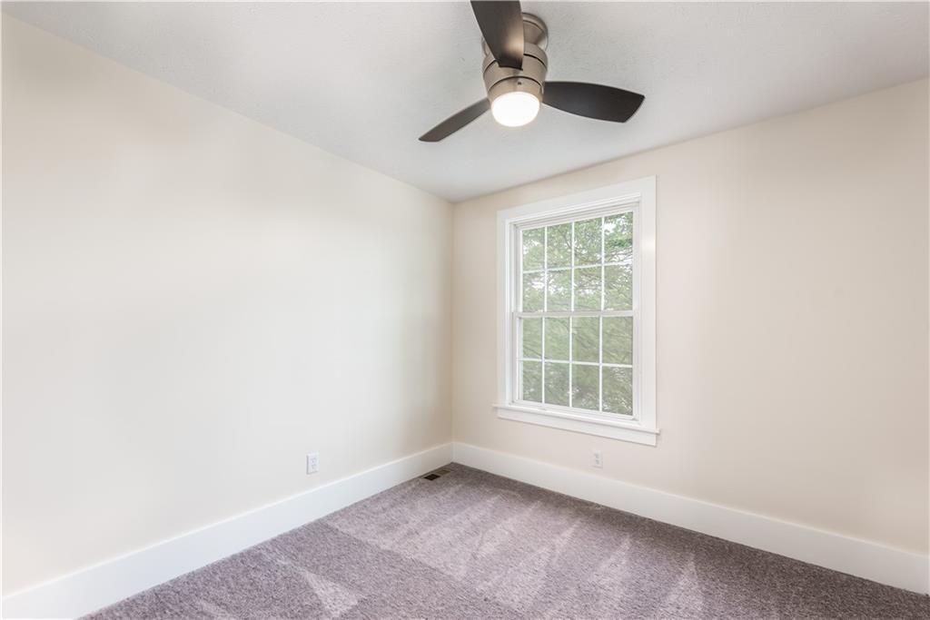 701 Main Street Irwin, PA 15642 - Photo 18 of 37 an empty room with a window