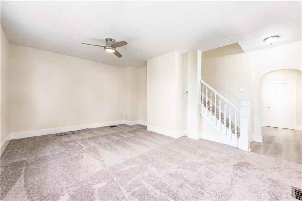 701 Main Street Irwin, PA 15642 - Photo 2 of 37 a view of an empty room with stairs