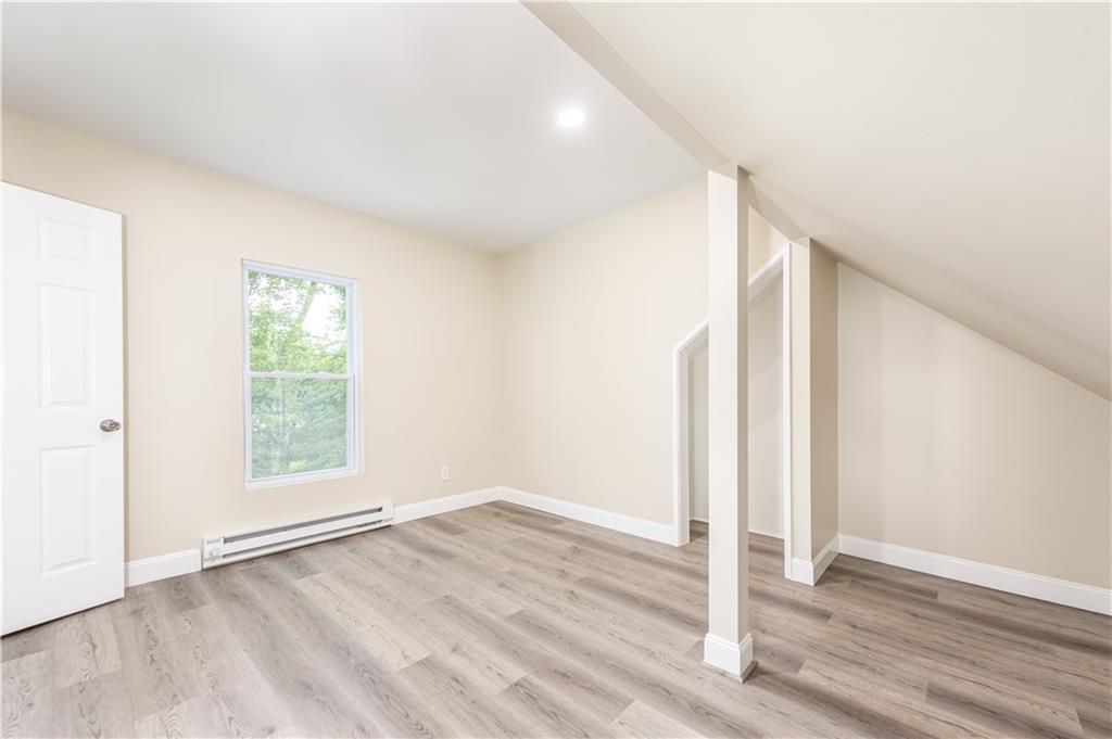 701 Main Street Irwin, PA 15642 - Photo 24 of 37 an empty room with wooden floor and window